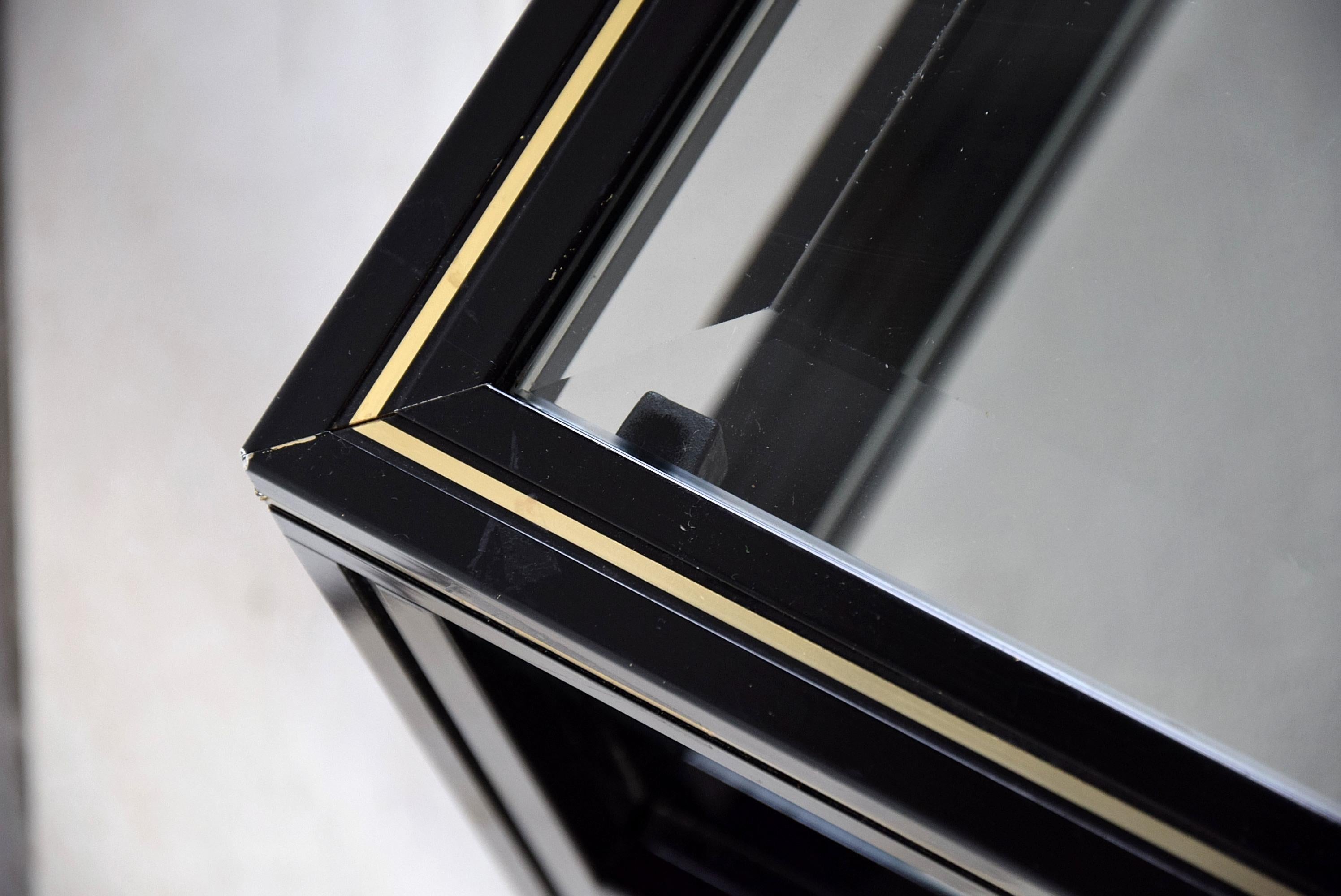Stylish Hollywood regency black and gold aluminium two-tier coffee table designed by Pierre Vandel Paris in the 1970s.
The table will be shipped overseas insured in a custom made wooden crate. Cost of insured transport to the US crate included is