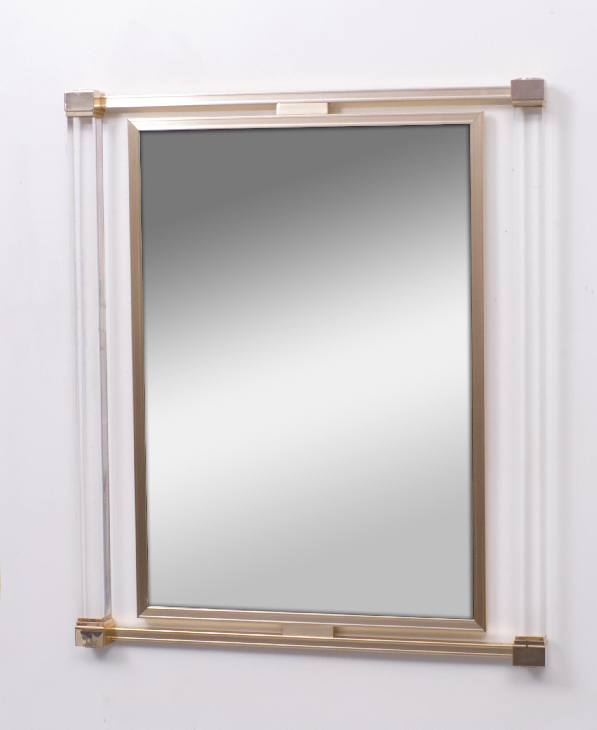 Very nice rare Pierre Vandel  Paris  Wall Mirror . Lucite square columns with .Brass fittings . The mirror fitted in a  Rose Gold Aluminum frame ..
Good condition . Design by Pierre Vandel  Paris 1970s            

Please don't hesitate to reach out