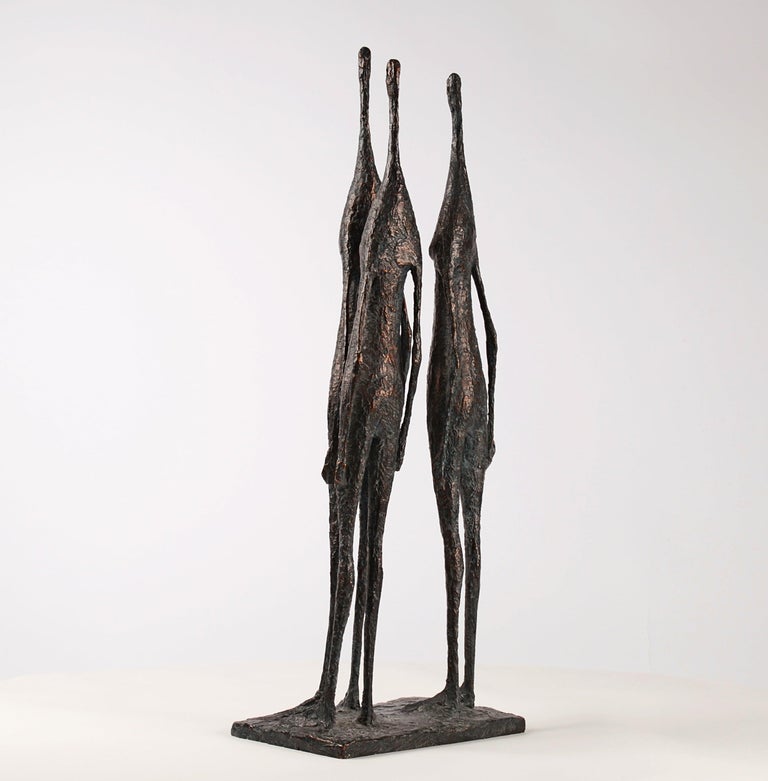 3 Standing Figures IV (3 Figures Debout IV) is a bronze sculpture by French artist Pierre Yermia. 
In this piece the sculptor is detailing the representation of the human figure placing importance on willowy, clean and slender forms while toying