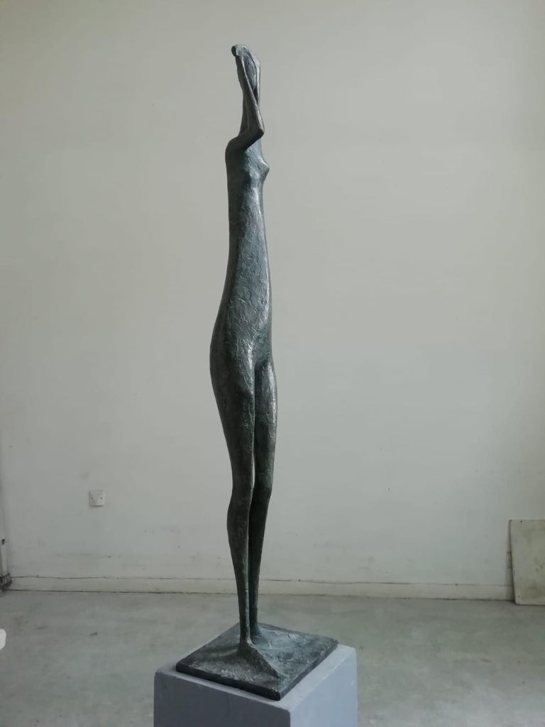 Great Arms Raised Standing Figure I (Grande Figure debout bras levés I), large-scale bronze sculpture by French contemporary artist Pierre Yermia. Bronze, 132 cm × 27 cm × 25 cm. Limited edition of 8 copies and 4 artist's proofs
