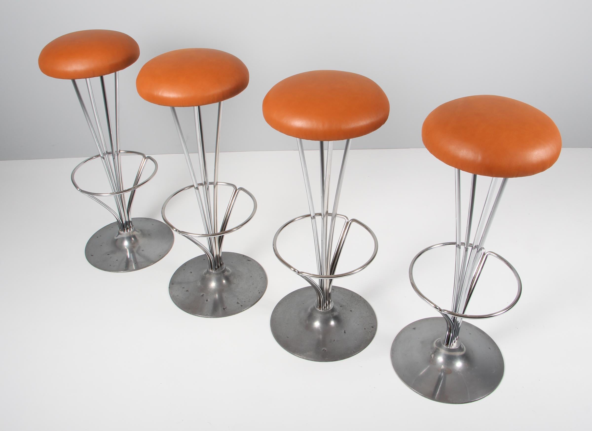 Piet Hein bar stools new upholstered with tan aniline leather.

Piet Hein base

Made by Fritz Hansen.