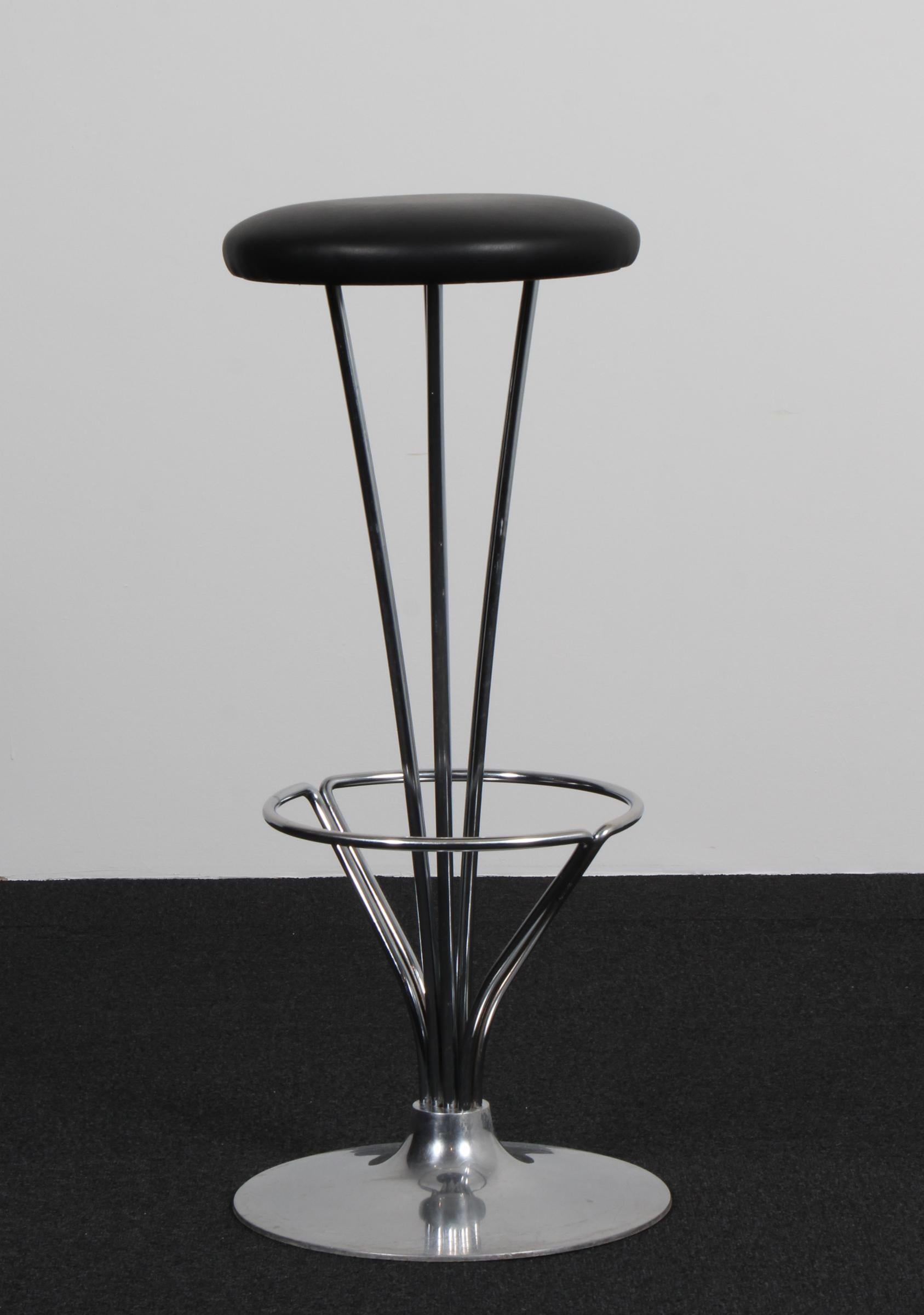 Piet Hein bar stools new upholstered with black pure full grain aniline leather.

Made by Fritz Hansen.