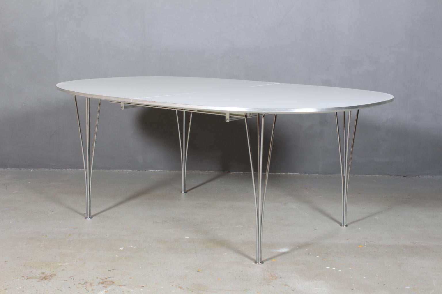 Piet Hein & Bruno Mathsson dining table with new professional lacquered white plate. With aluminium side.

Two Extension leaf of 60 cms.

Legs of chromed metal.

Model Super Elipse, made by Fritz Hansen.

This is one of the most iconic tables in