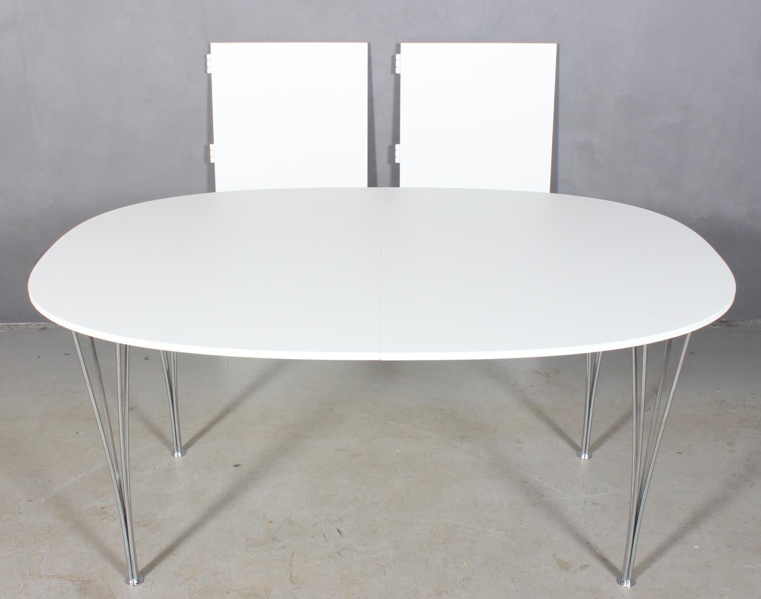 Piet Hein & Bruno Mathsson dining table with new professional lacquered white plate.

Two extension leaf of 50 cms.

Legs of chromed metal.

Model Super Elipse, made by Fritz Hansen.

This is one of the most iconic tables in Scandinavia.