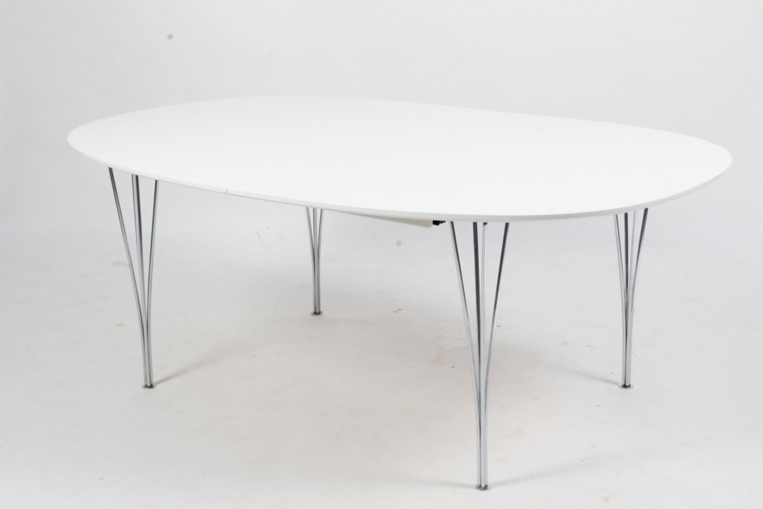 Piet Hein & Bruno Mathsson dining table with new professional lacquered white plate. One extension leaf of 60 cms.

Legs of chromed metal.

Model Super Elipse, made by Fritz Hansen.

This is one of the most iconic tables in the Scandinavia.