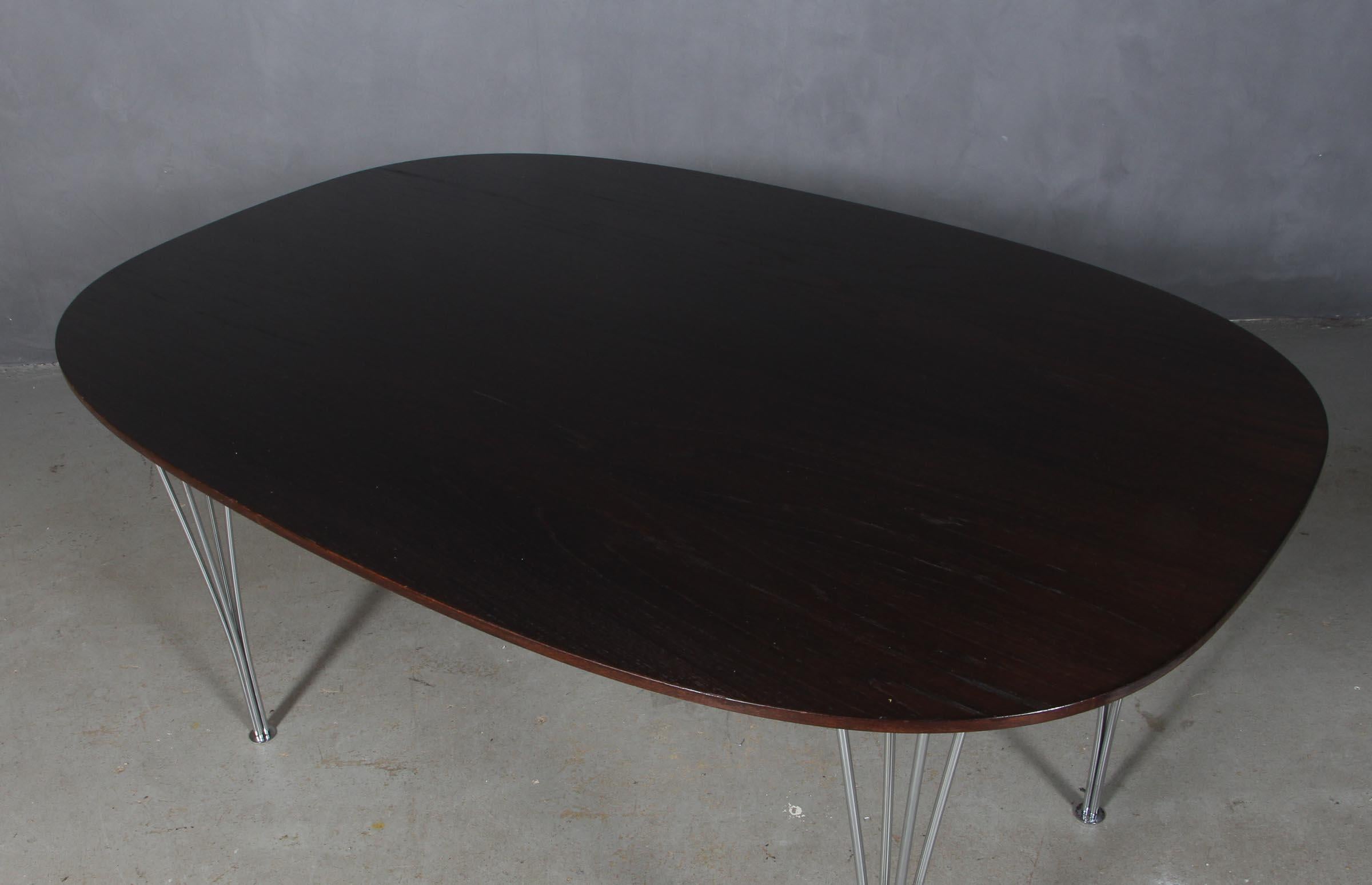 Piet Hein & Bruno Mathsson ellipse dining table veenered smoked oak.

Legs in chromed steel.

Made by Fritz Hansen.
 