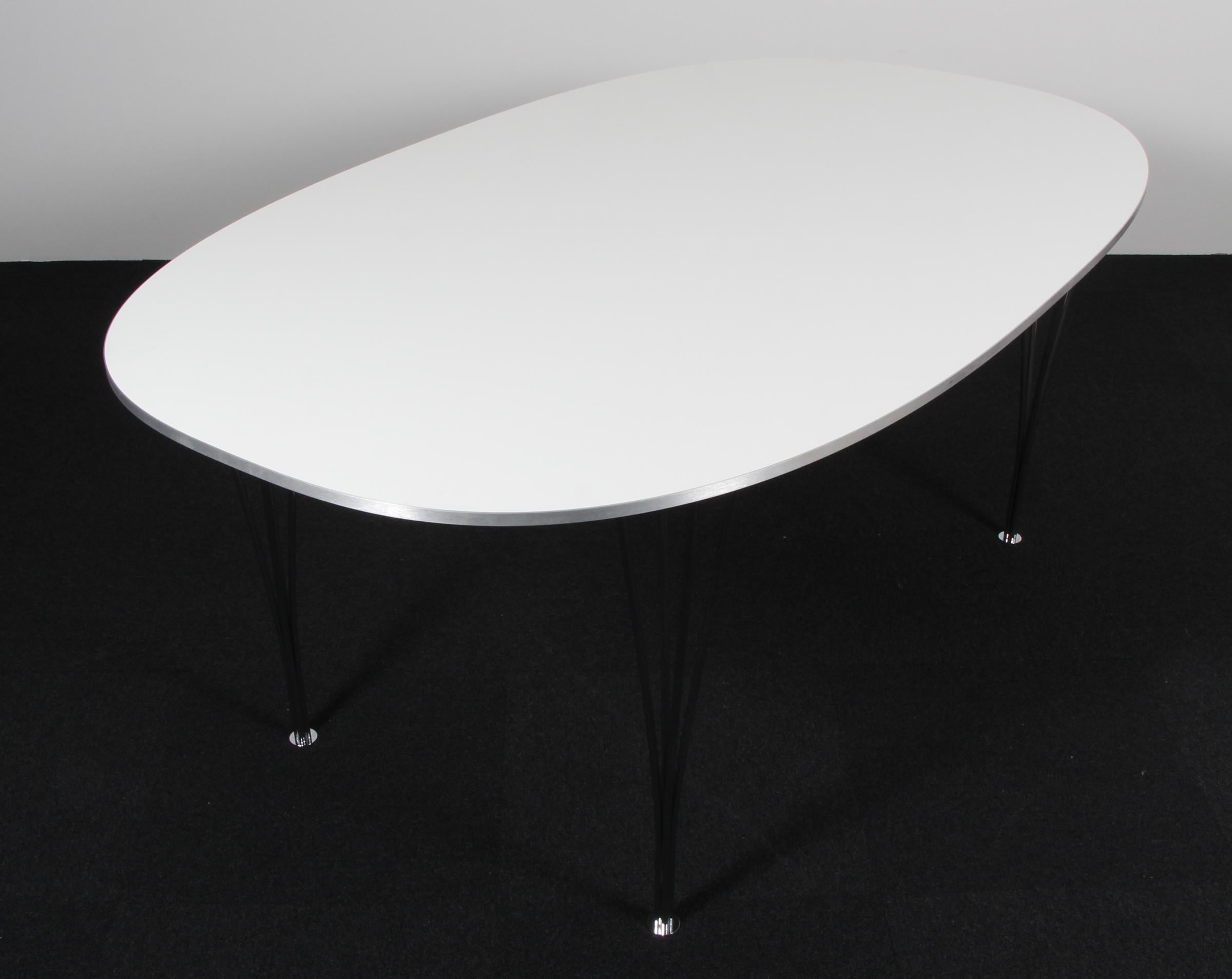 Piet Hein & Bruno Mathsson ellipse dining table with laminate.

Legs in chromed steel.

Made by Fritz Hansen.
 