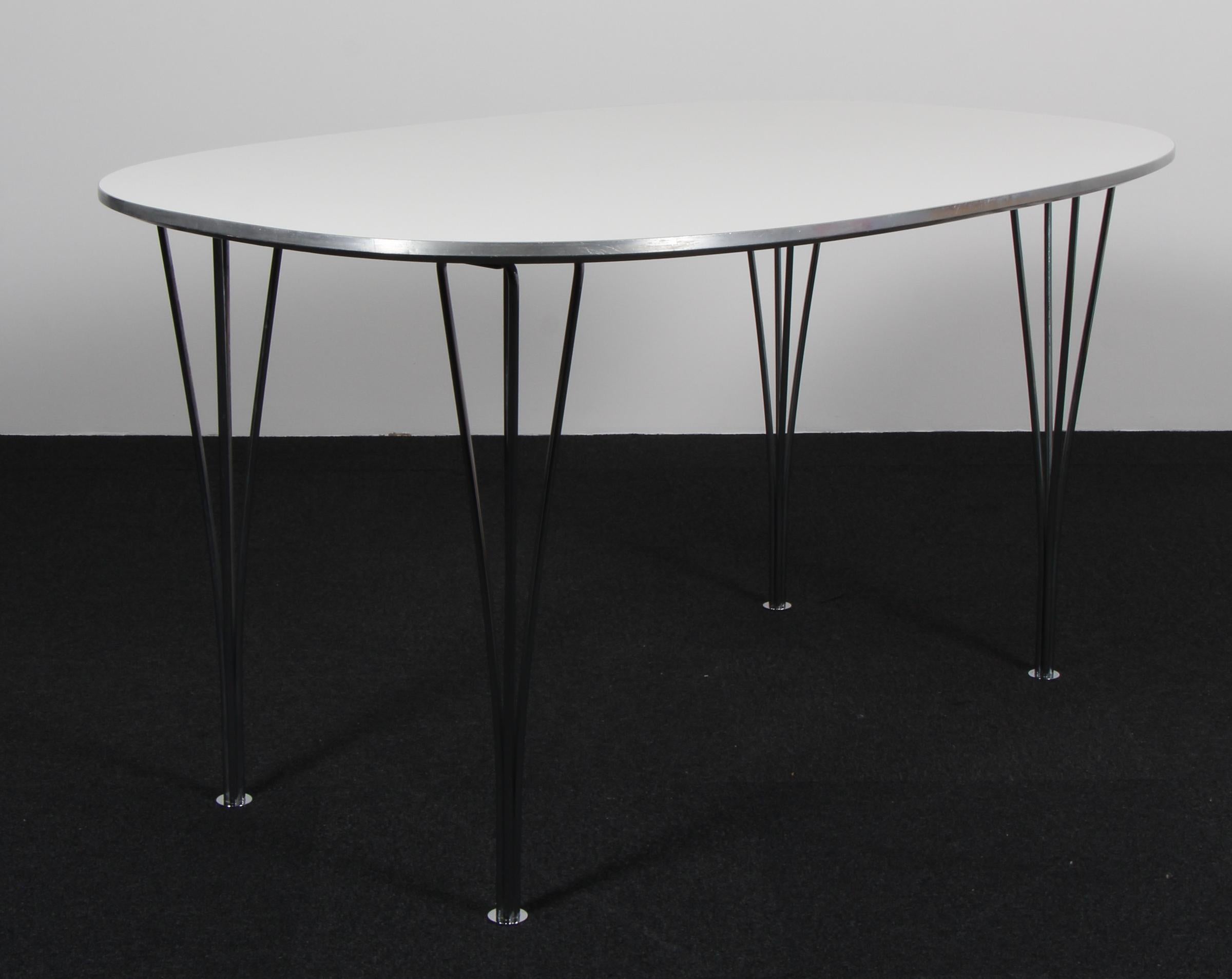 Piet Hein & Bruno Mathsson ellipse dining table with laminate.

Legs in chromed steel.

Made by Fritz Hansen.
 