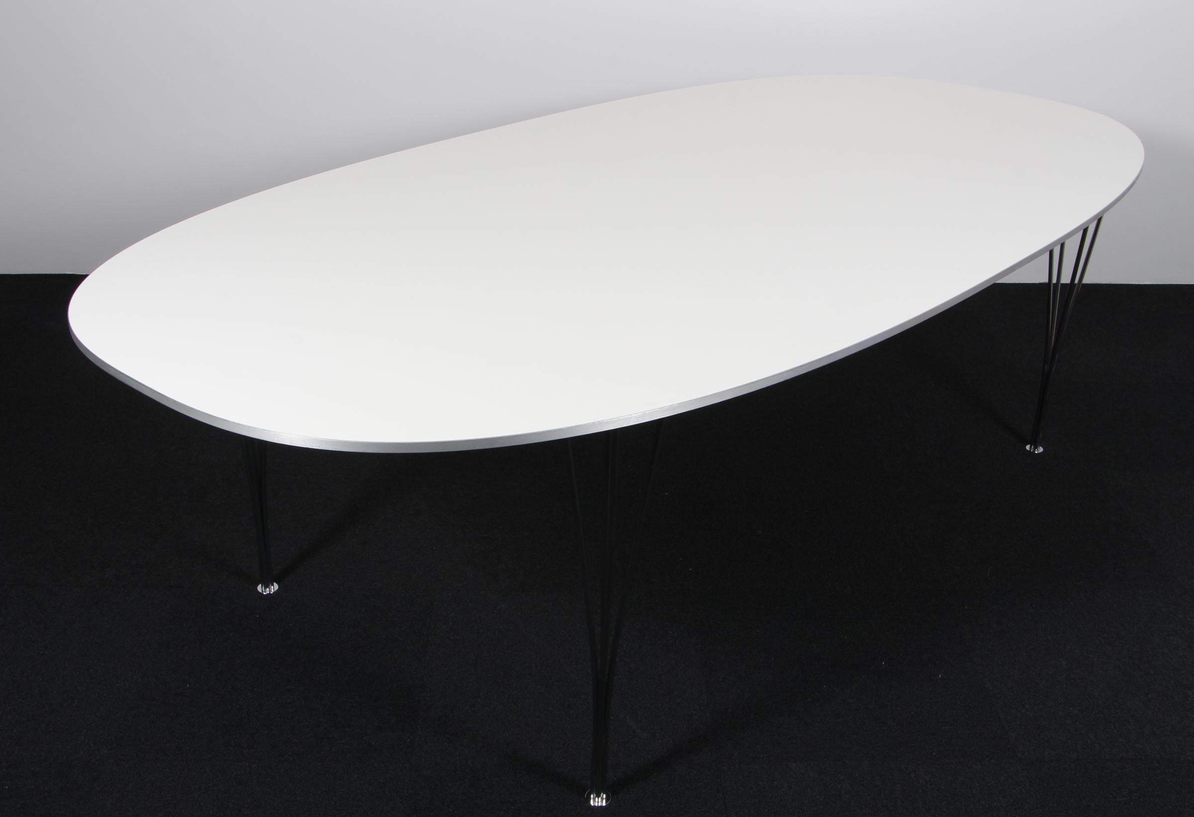 Piet Hein & Bruno Mathsson ellipse dining table with laminate.

Legs in chromed steel.

Made by Fritz Hansen.
 