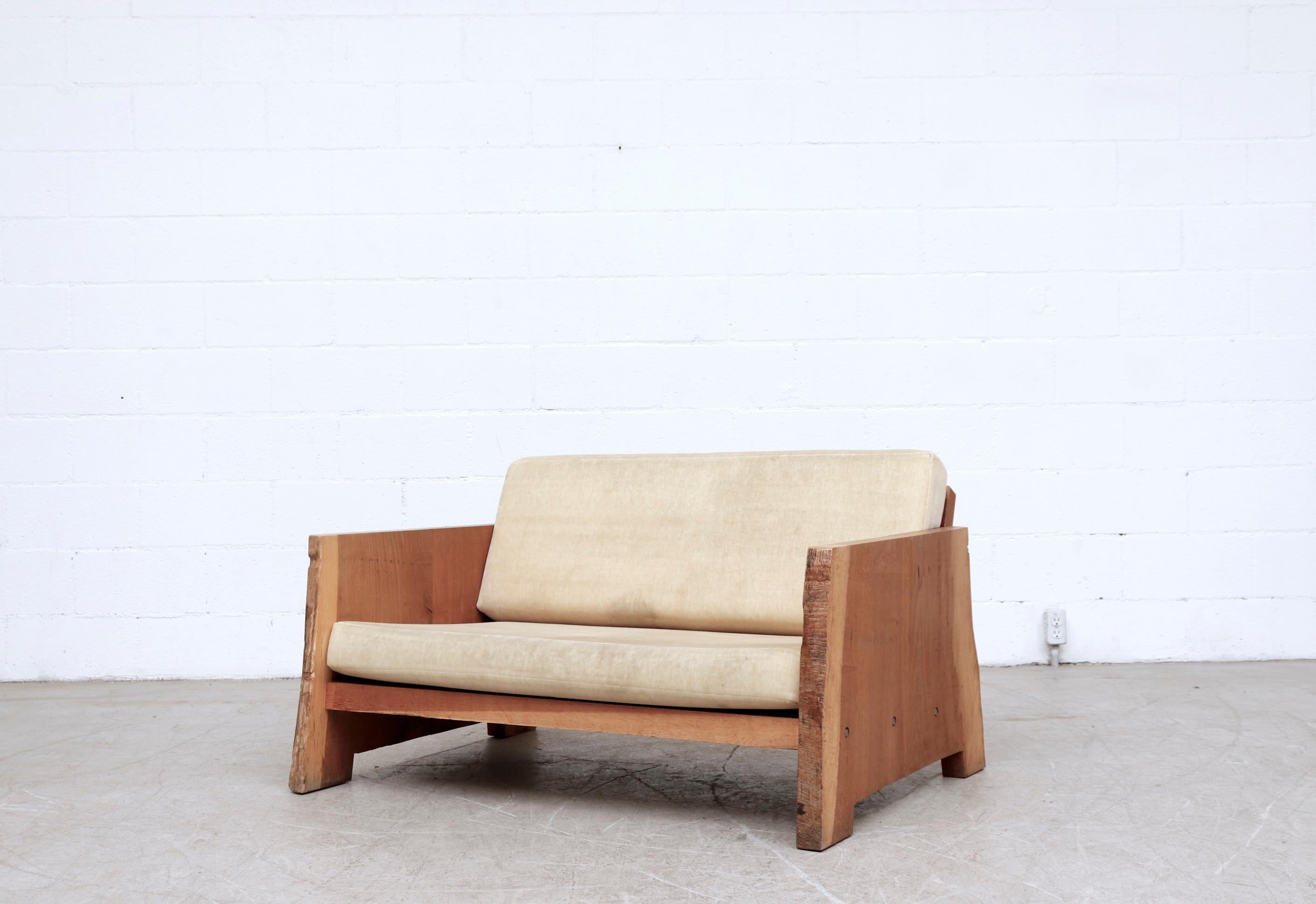 Gorgeous live edge solid oak Piet Hein eek loveseat with original mohair cushions. This listing is for the loveseat only. Cushions show visible wear and staining. The sofa is made of massive rough cut slices of tree with large lag bolt fastening in