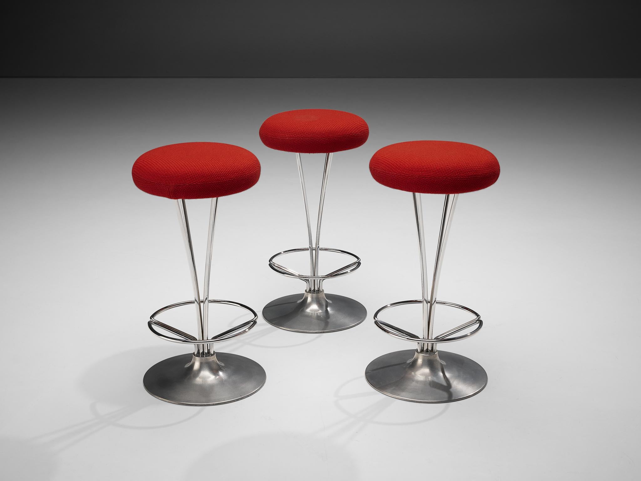 Piet Hein for Fritz Hansen, set of three bar stools, metal, red fabric upholstery, Denmark, 1970s
 
Set of three bar stools designed by Piet Hein for Fritz Hansen. These stools hold an excellent mix of materials, creating a nice contrast between the