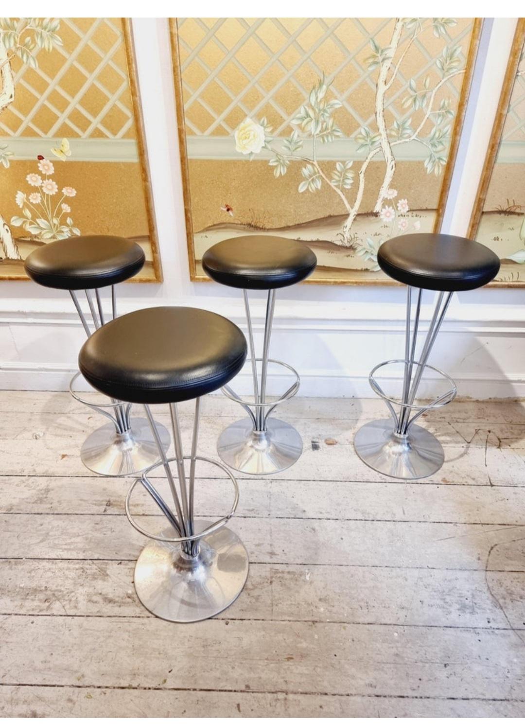 Bar stools designed by Piet Hein in the 1960s for Fritz Hansen,. Base in stainless steel and seat with original leather. Denmark, this set is produced in 1999. One stool with original tag left, date and production info. Price per piece.

A timeless