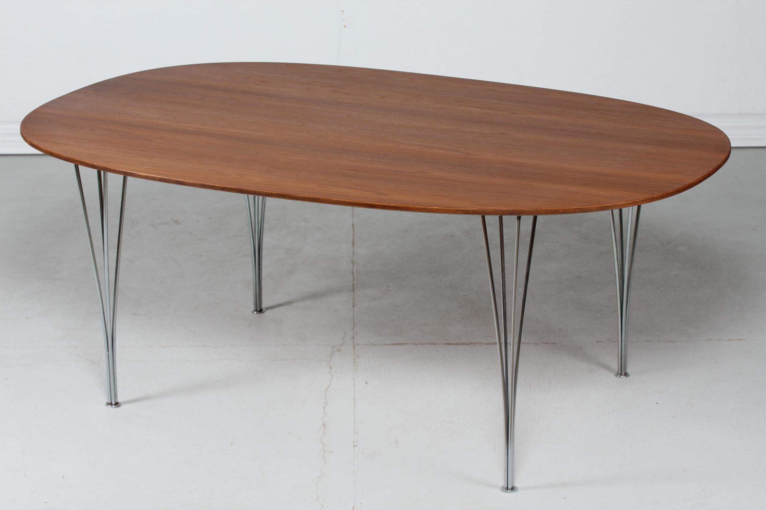 Danish modern large super ellipse table designed by Piet Hein (1905-1996) and Bruno Mathsson
with table top with new oil treated teak veneer.

One of the greatest classics based on Piet Hein's legendary super ellipse shape, which was
created