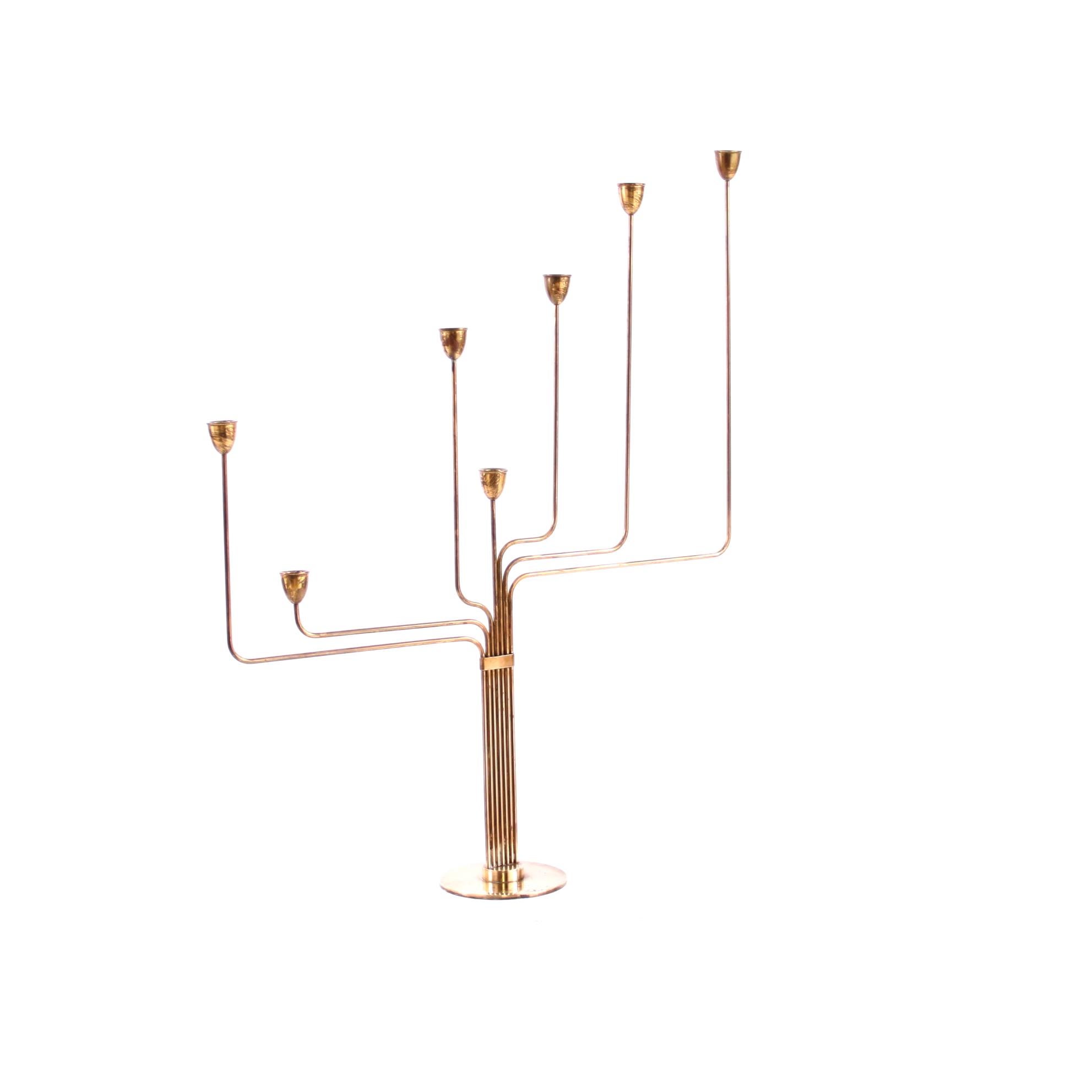 PIET HEIN   -   SCANDINAVIAN MODERN

First edition of the beautiful candelabrum by the Danish modernist and designer, poet, mathematician and architect Piet Hein. 

The candelabrum has seven arms and in solid brass. It was named 