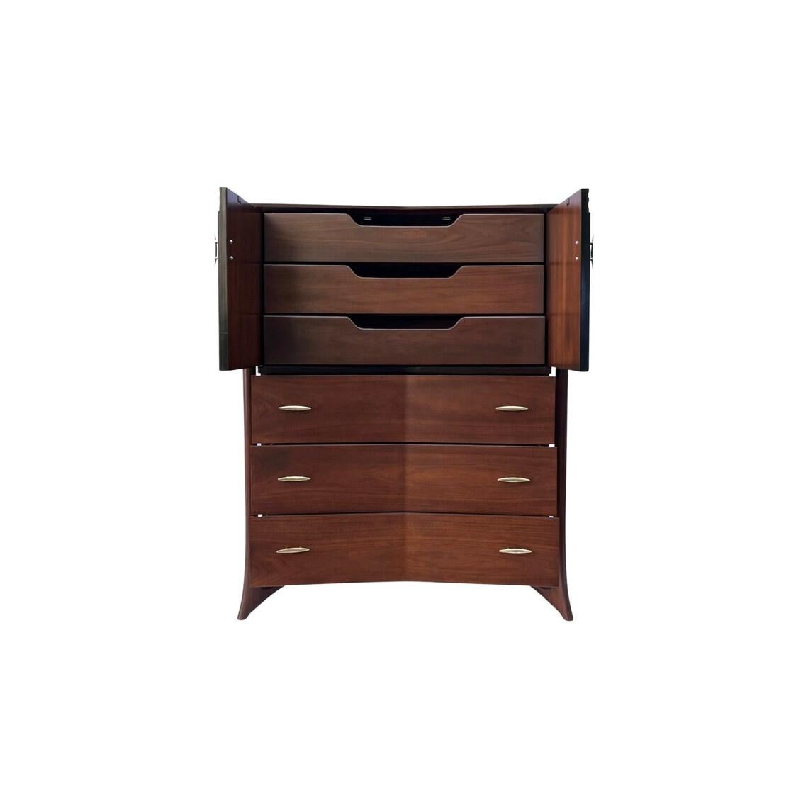 Introducing an exquisite example of mid-century modern design, behold this stunning walnut and brass highboy dresser by the renowned designer Piet Hein. Meticulously crafted, this sculptural masterpiece features hand-formed solid walnut legs,
