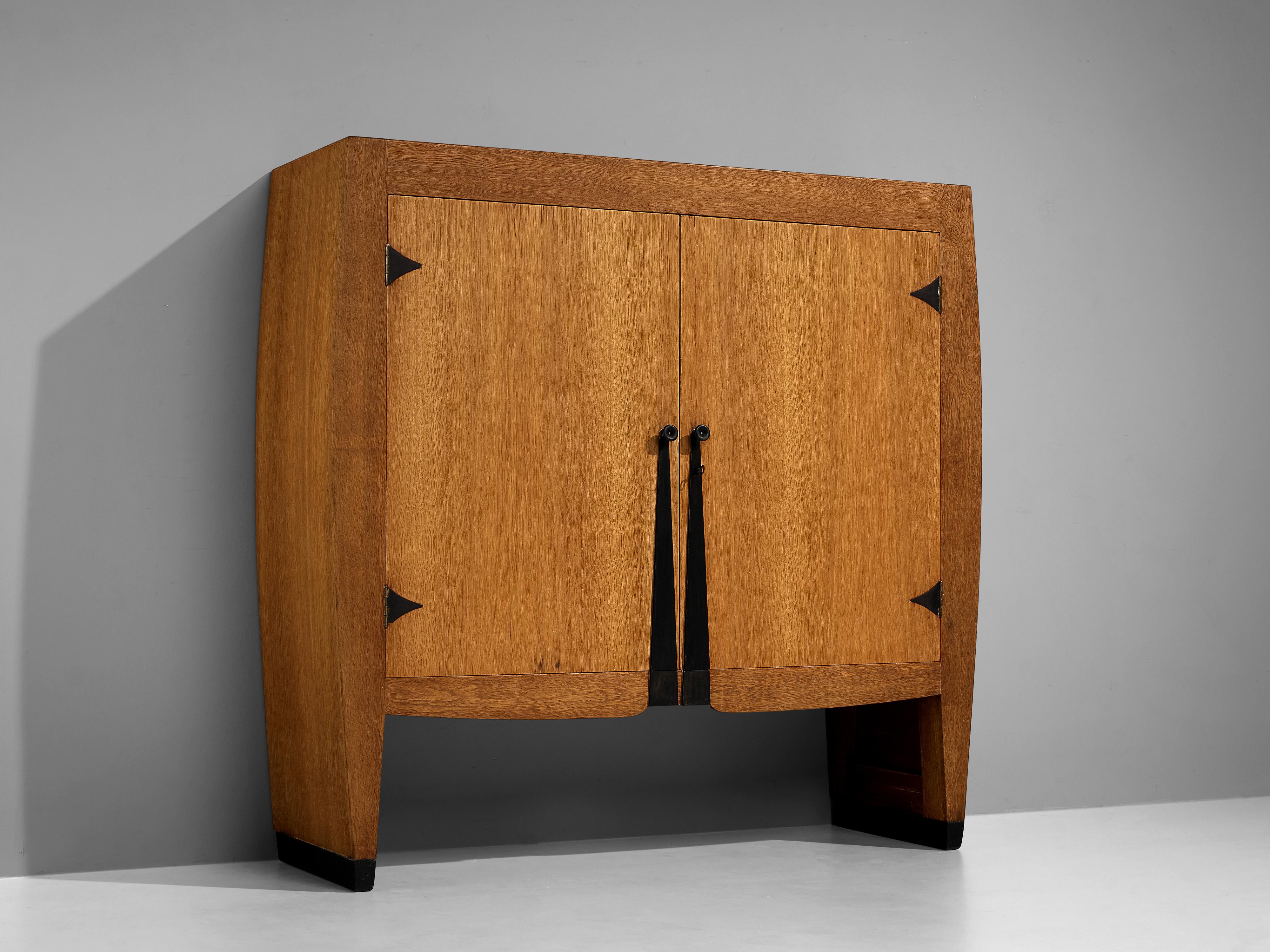 Piet Kramer, cabinet, oak, ebonized wood, Bakelite, metal, The Netherlands, 1920s

Exceptional rare cabinet designed around 1920 by well-known Dutch architect Piet Kramer. The big wardrobe, historically used as a linen cabinet, has beautiful