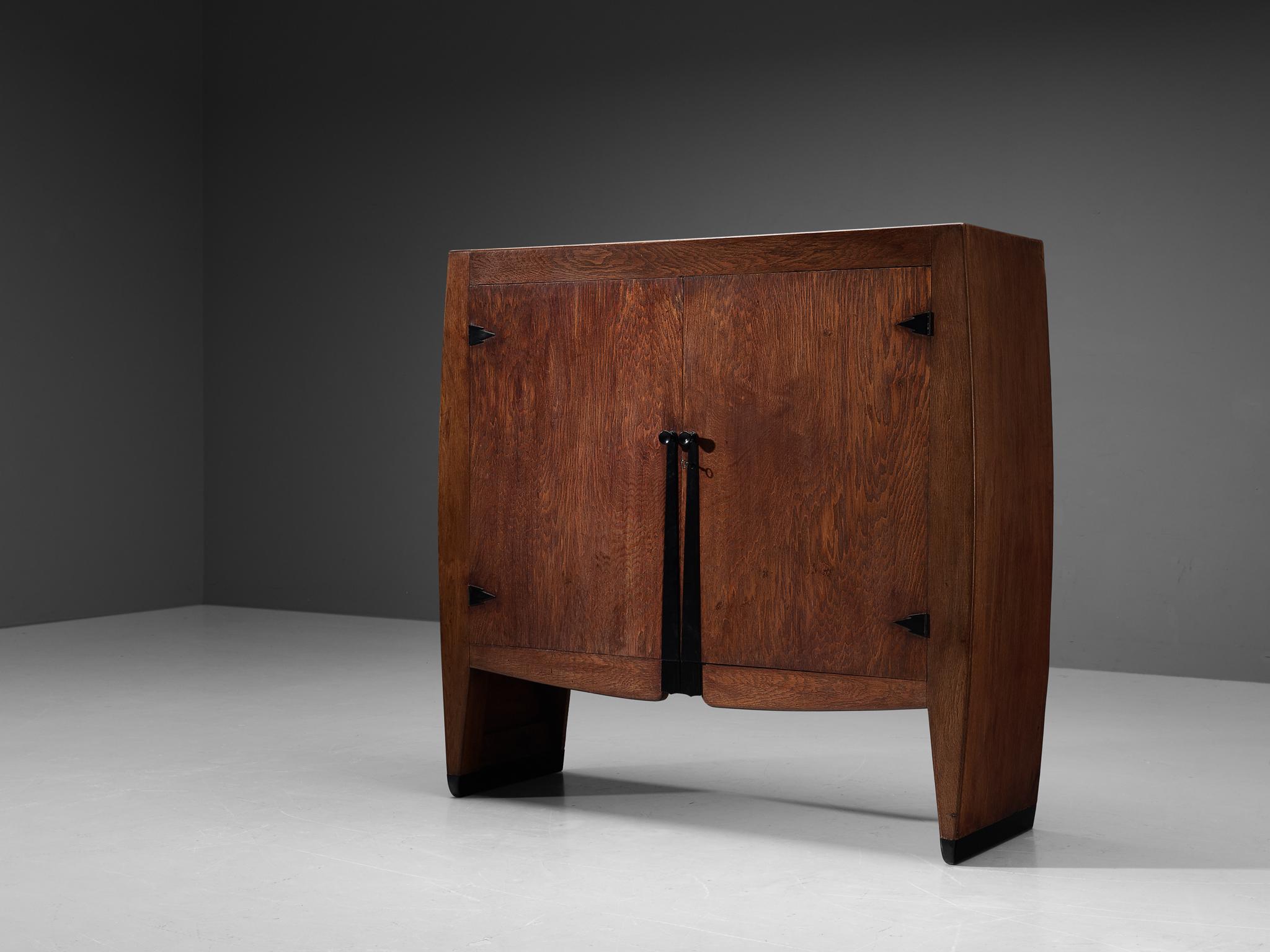 Piet Kramer, cabinet, oak, ebonized wood, Bakelite, metal, The Netherlands, 1920s

Exceptional rare cabinet designed around 1920 by well-known Dutch architect Piet Kramer. The big wardrobe, historically used as a linen cabinet, has beautiful