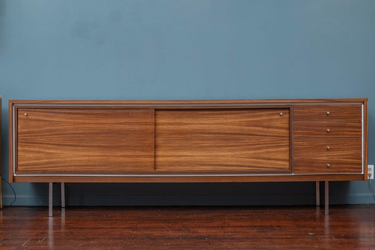 Pieter De Bruyne design rosewood credenza for V-Form, Belgium. Large and inpressive contemporary looking credenza with rosewood veneers on stainless steel legs and pulls. Laminated interiors and drawers made from high quality materials and