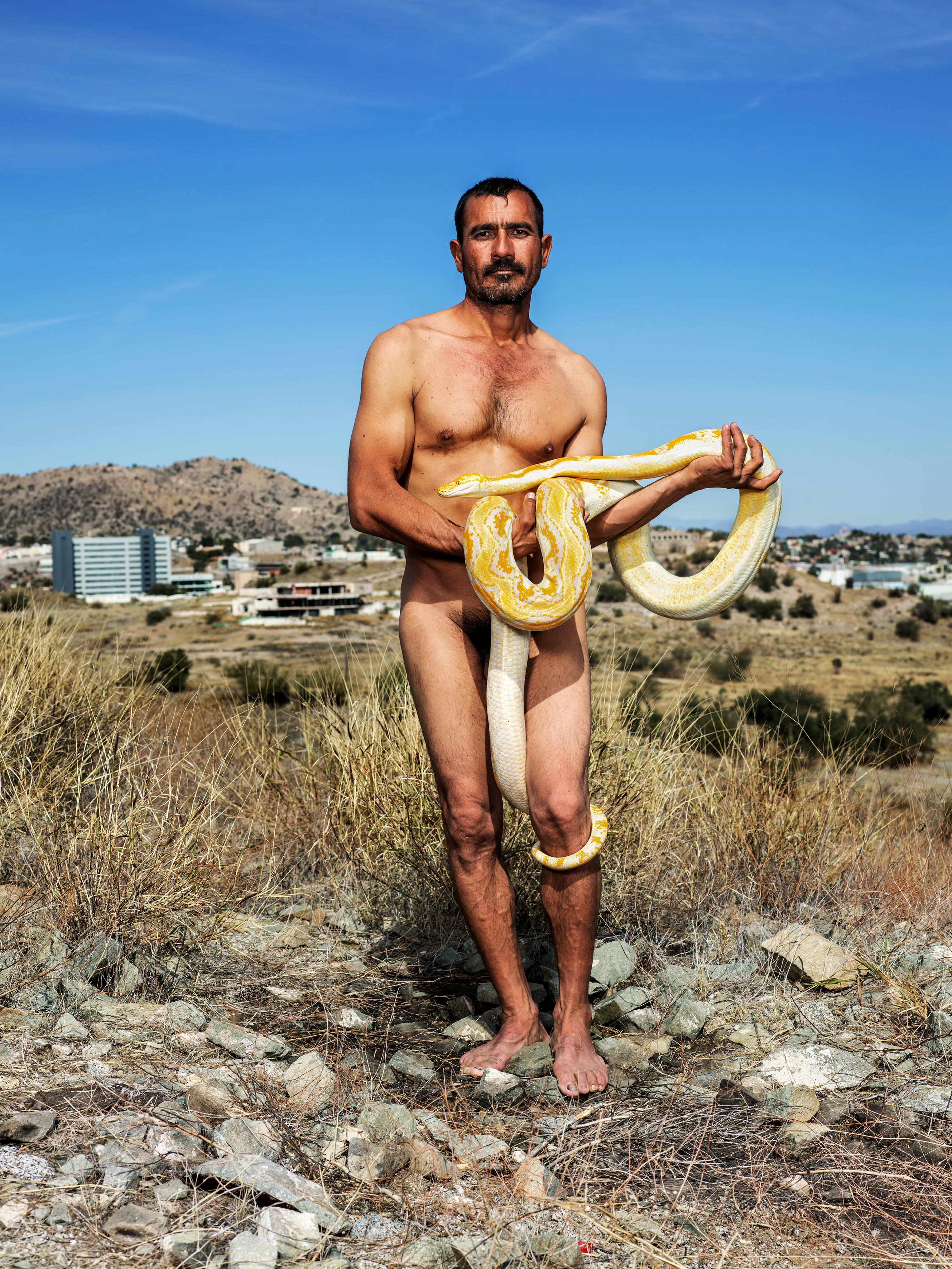 The Snake Charmer, Hermosillo, 2019 - Pieter Hugo (Colour Photography)
Signed on reverse
Archival pigment print

Available in two sizes:
47 x 35 1/2 inches, edition of 7 + 2 APs
63 x 47 inches, edition of 7 + 2 APs

Pieter Hugo (born 1976) is a