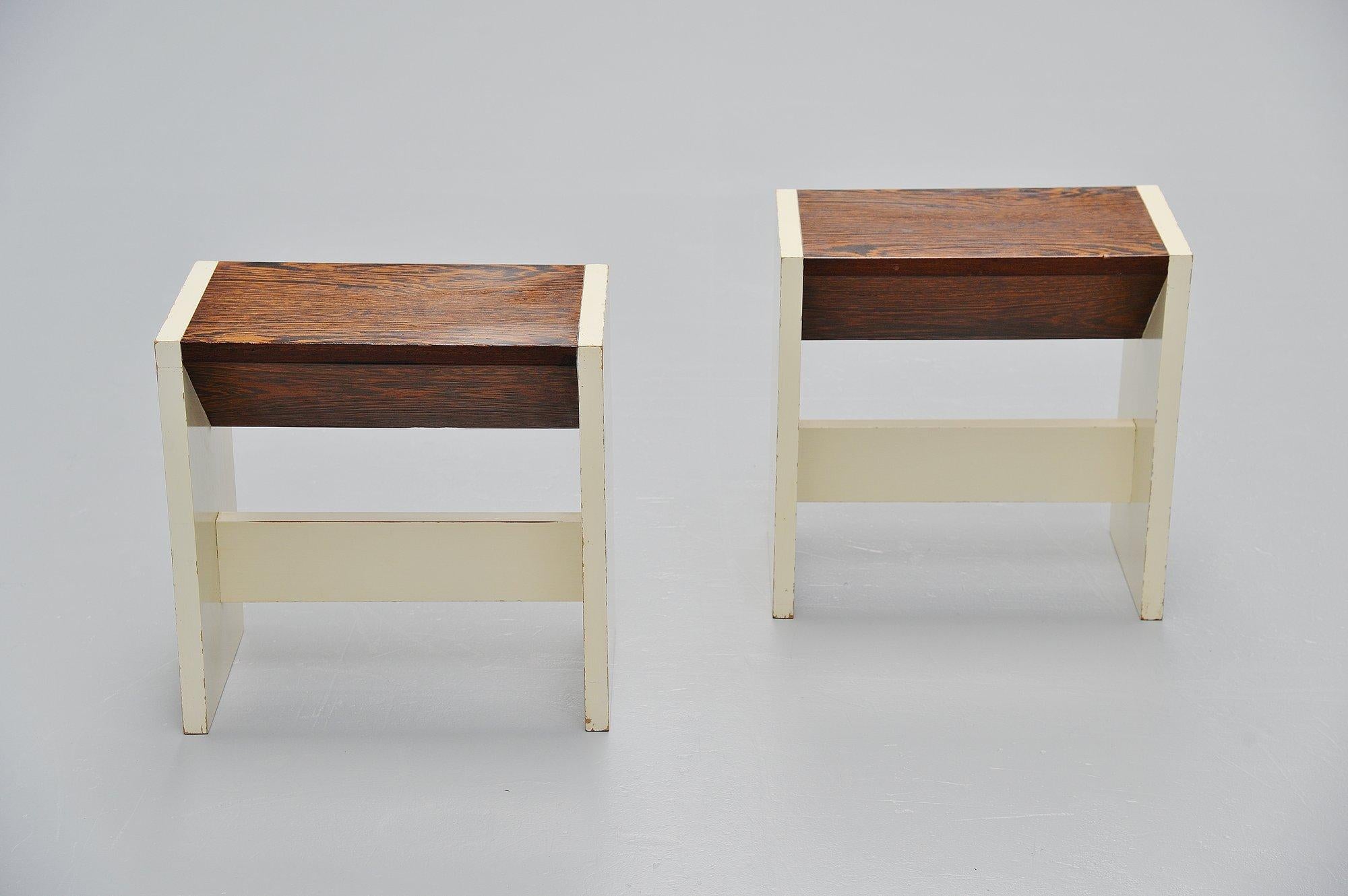 Very nice and unique pair of architectural stools designed by Pieter Maris, Weesp, Holland, 1960. This unusual shaped set of stools were made of white painted plywood and wenge wooden seats with unusual shape. The stools have a fantastic nice shaped
