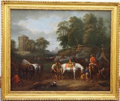 A hunting party at an encampment, with horses and dogs