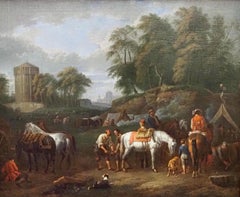 A hunting party at an encampment, with horses and dogs