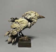 Sculpture en bronze de Witte Roepie Rupee appelant un oiseau blanc