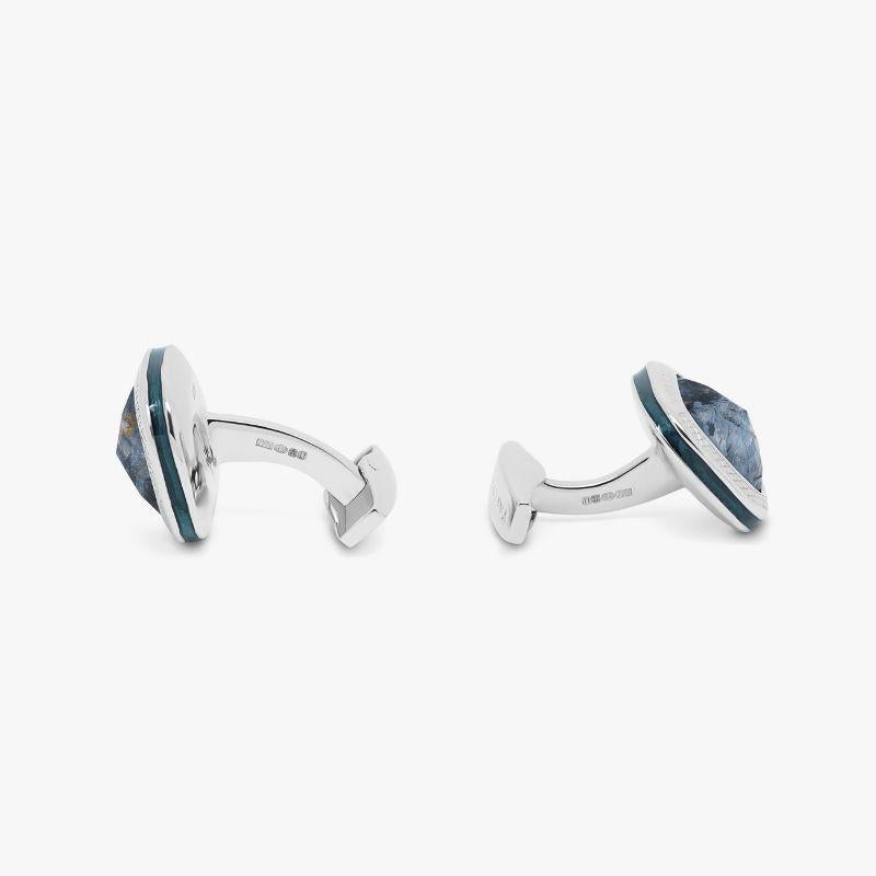 Pietersite Doppione Cushion Cufflinks in Sterling Silver

Rose cut Pietersite sits below a cabochon of quartz, cleverly combined to create a 'doublet'. This unusual collaboration of semi-precious stones inlay our classic square case, with blue