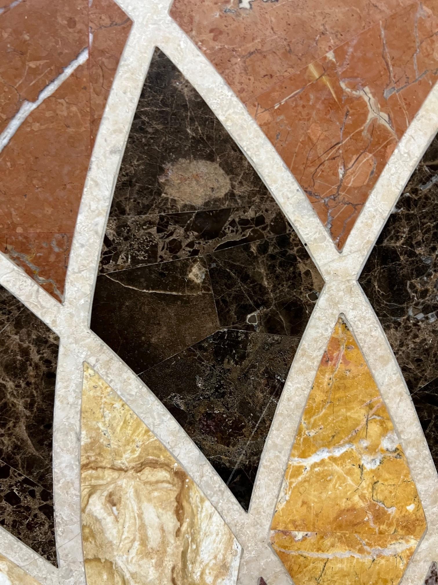 Mesa redonda de mármol y mosaico de piedra 