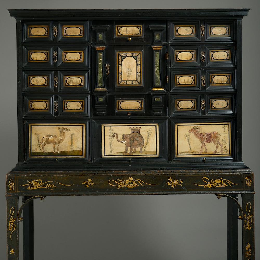 An exceptional Pietra Dura and ebony cabinet, mid 17th century, the japanned stand attributed to William & John Linnell, circa 1752-55.

The cabinet with pietra paesina panelled drawers around a door flanked by verde antico pilasters and enclosing