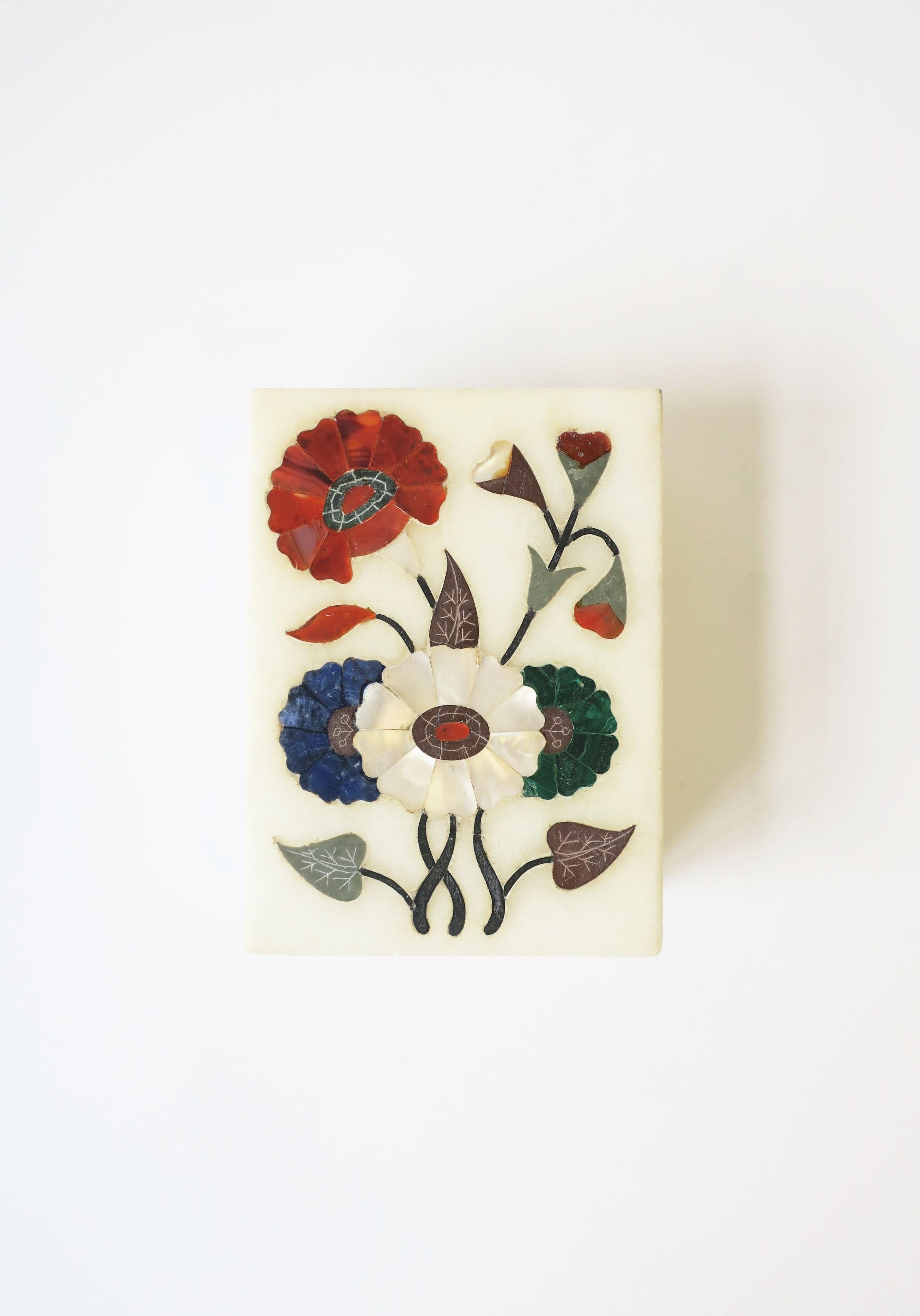 There are two box available, each sold separately.

A beautiful multi semi-preciouses stone floral inlay or 'pietra dura' design box, circa 20th century. Box cover includes red carnelian, blue lapis, green malachite, white mother of pearl and other