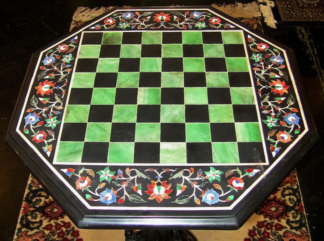 Stunning ‘Pietra Dura” style marble table with incorporated chess board on beautiful and unusual tripod table stand.

Indian or South East Asian, but most likely Indian/Sri Lankan (Ceylon).

The board is hexagonal in shape and measures 18' x