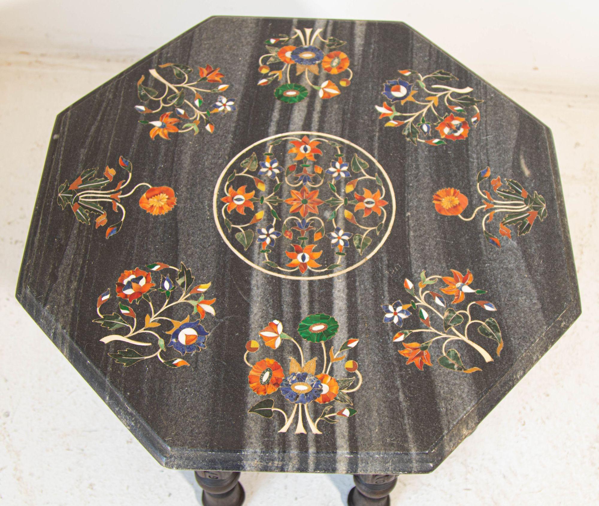 Vintage hand-crafted Pietra Dura Marble inlaid Octagonal Top Side Table Agra India.
Black marble Pietra Dura mosaic octagonal low side table marble inlaid with semiprecious stone like Lapis, Jade, Turquoise, jasper, carnelian for orange and natural