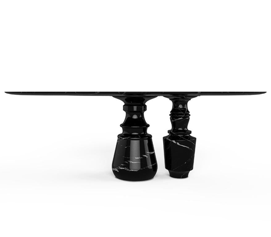 Playing with function and sculptural form, the Pietra dining table shapes a timeless experience through its classical aura and finest Nero Marquina black marble. Reminding the renaissance era, its oval top gently lies in two robust marble columns,