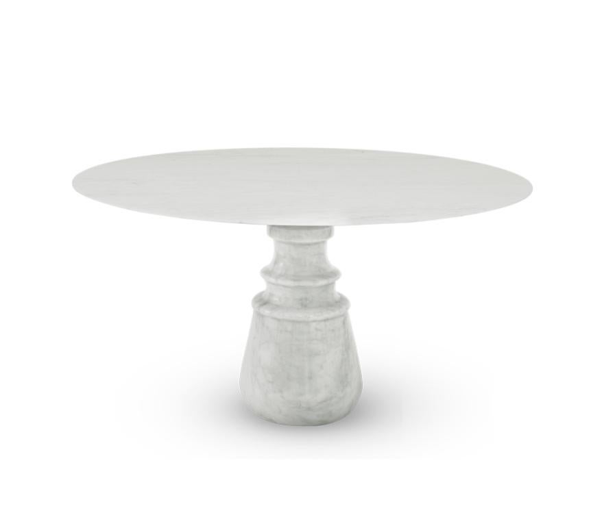 Playing with function and sculptural form, the Pietra dining table shapes a timeless experience through its classical aura and finest Estremoz white marble. Reminding the renaissance era, its round top gently lies in one robust marble column,