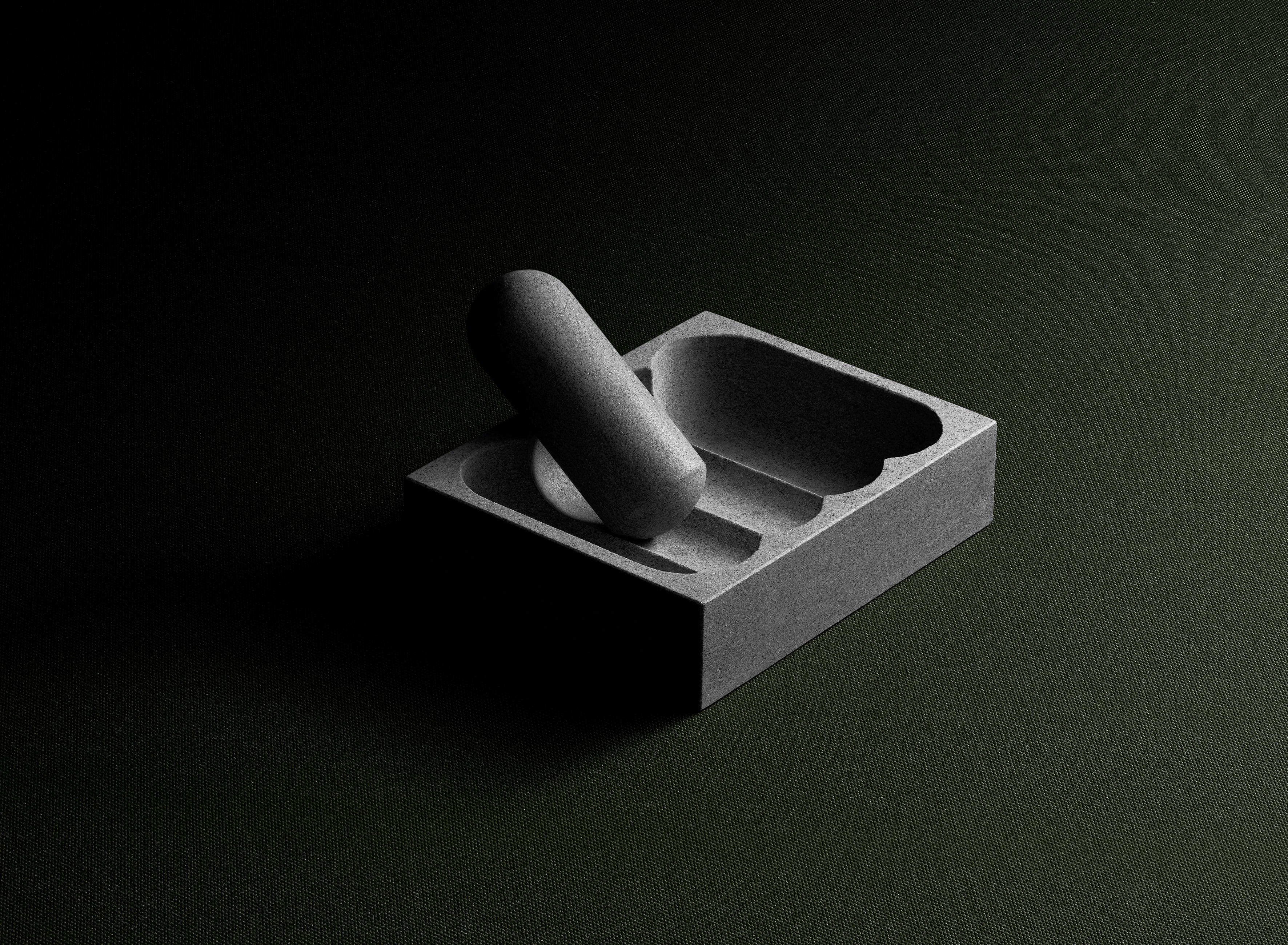 Pietra Serena Flure Mortar and Pestle by Tino Seubert
Dimensions: W 10 x D 12.6 x H 32 cm.
Materials: Pietra serena sandstone carved in Italy.
Also available in Rosso Etrusco sandstone. 

Tino Seubert
When he first made his now signature