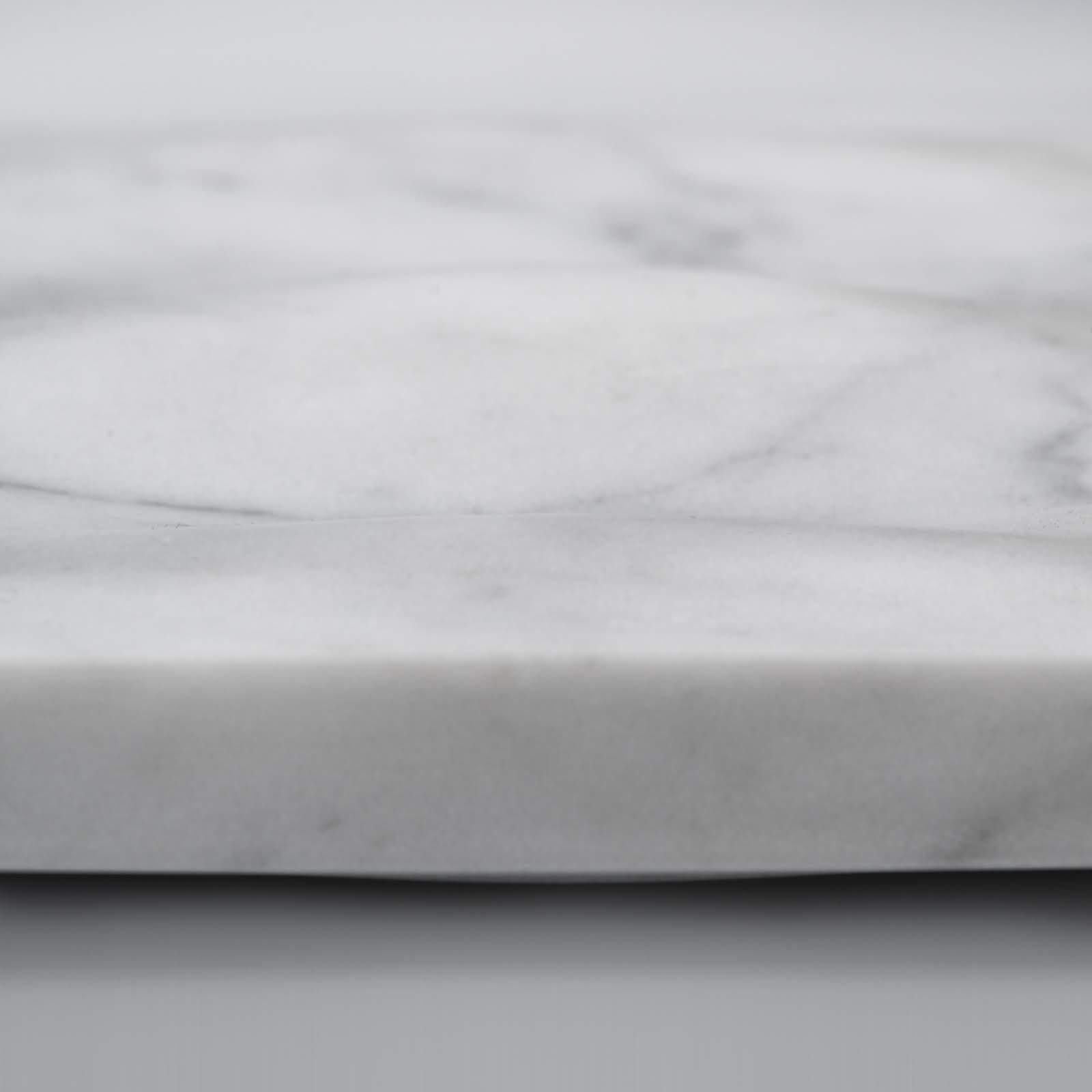 Monolithic marble centerpiece, made of solid Bianco Carrara marble.
   