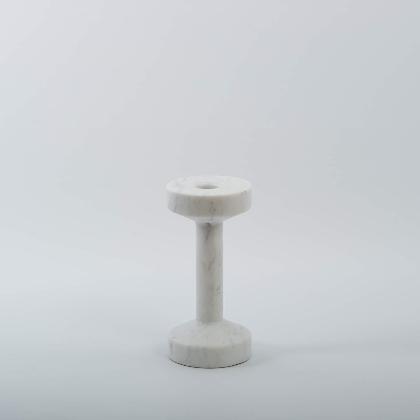Monolithic marble candlestick and fitness handlebar.     
    