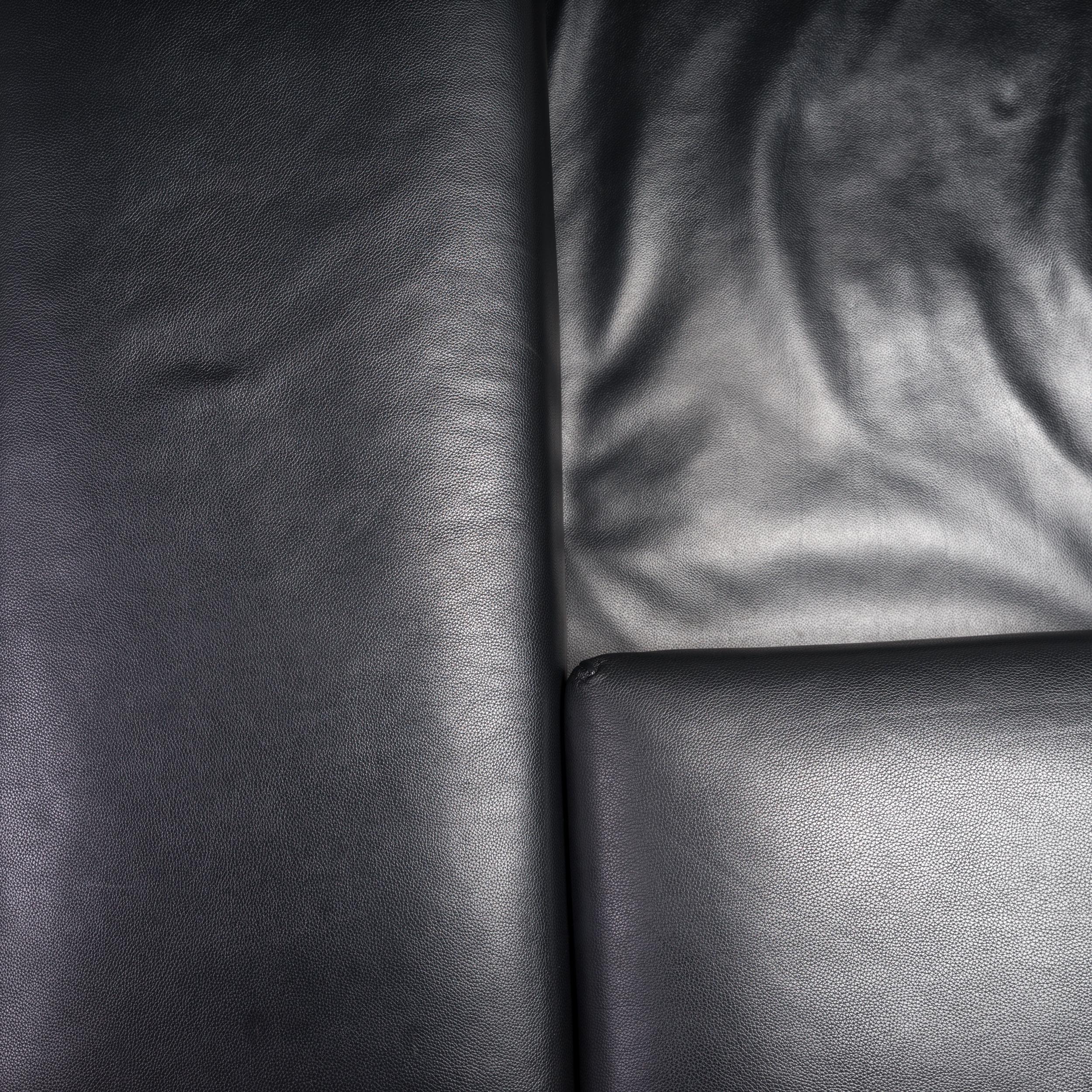 Designed by Pietro Arosio for Tacchini, the Happy Hour sofa is a fantastic example of modern Italian design.

This three seat model is constructed from a steel base frame sitting on chrome plated feet, and is fully upholstered in black