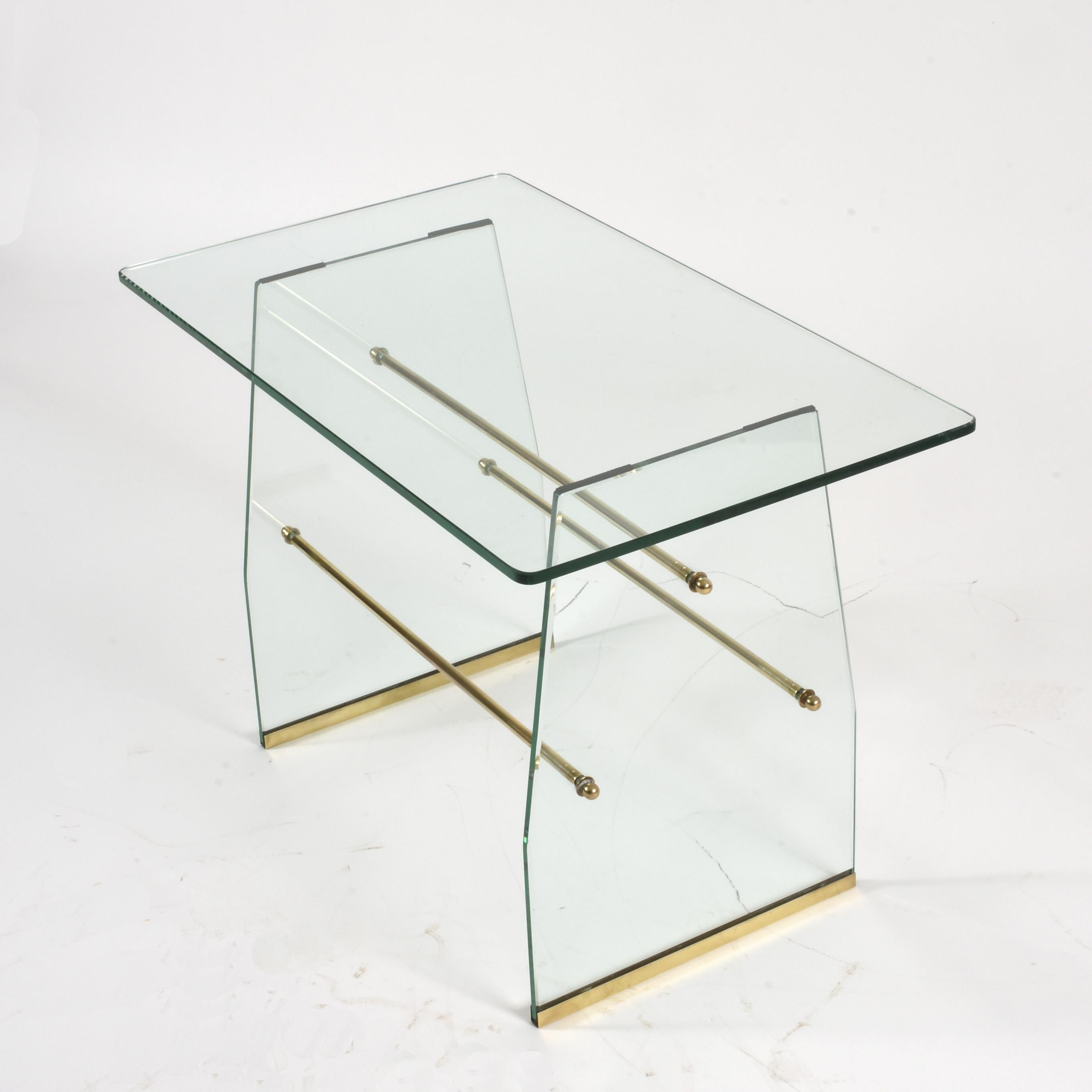 Extraordinary and extremely rare table attributed to Pietro Chiesa for Fontana Arte, circa 1935. Solid glass structure with brass base.
Glass with a beautiful shade of green, The base is joined by three brass tubes (easily removable for shipment or