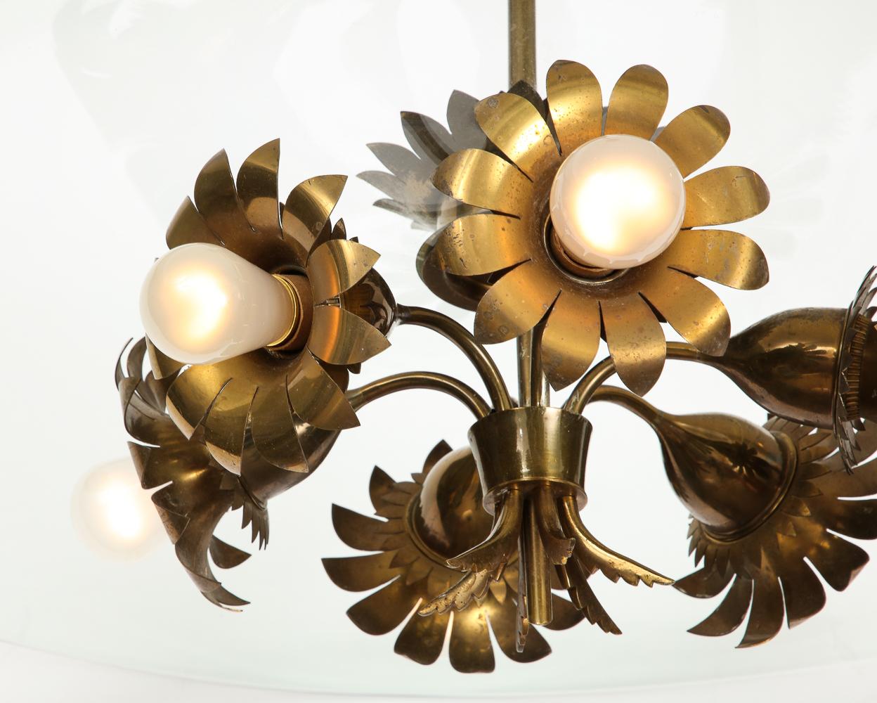 Rare ceiling fixture by Pietro Chiesa for Fontana Arte. Brass, glass. Lacquered brass with six flower-shaped socket holders and intricate floral motif decorations. Beveled clear glass disc, and original brass canopy.
