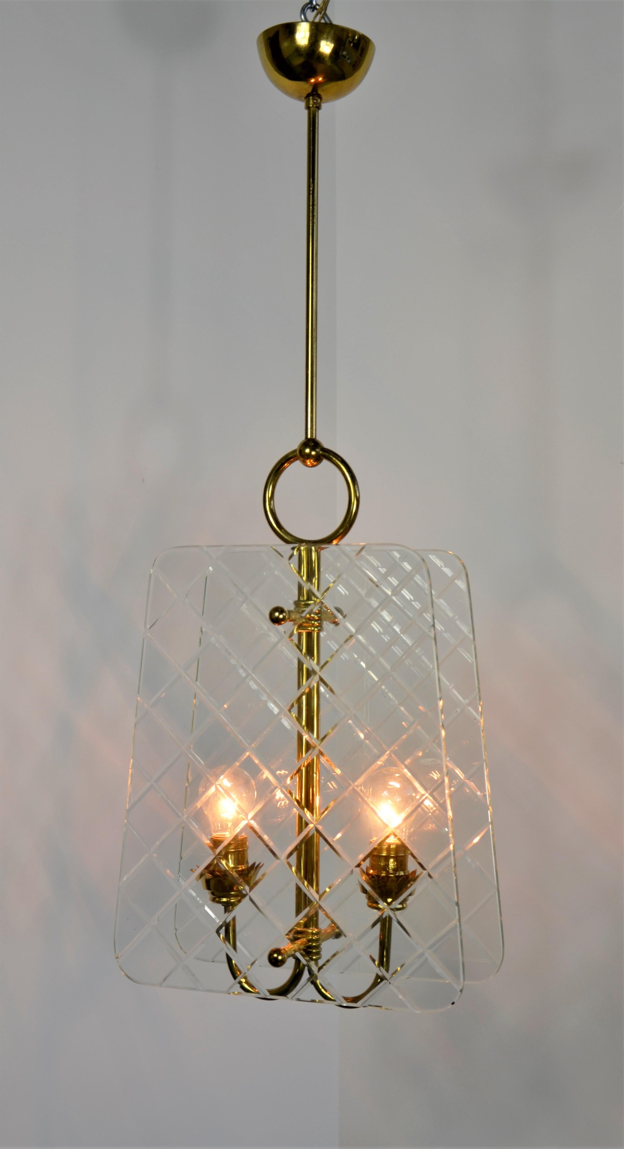 Offered is a Mid-Century Modern Italian Pietro Chiesa for Fontana Arte brass and harlequin pattern cut glass chandelier. This elegant chandelier is attributed to designer Pietro Chiesa. The photo of this piece speaks for itself. One of a kind