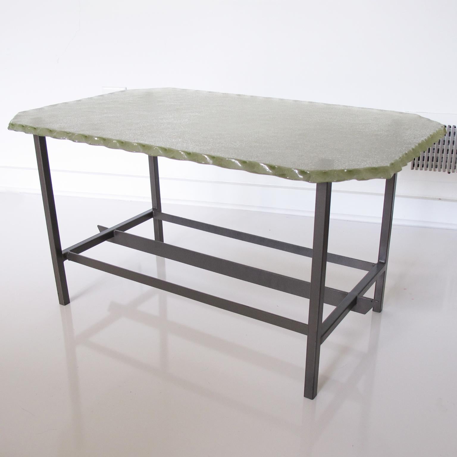 Pietro Chiesa designed this lovely modernist glass and metal coffee table for the renowned Italian manufacturer Fontana Arte in the 1940s. This rectangular coffee table, with its 