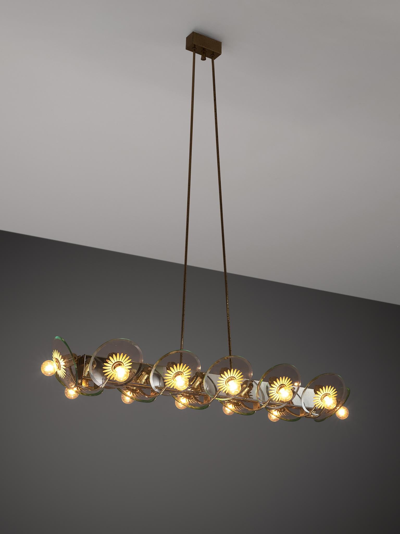 Pietro Chiesa for Fontana Arte, chandelier, brass and glass, Italy, 1940s.

This large chandelier by Italian designer Pietro Chiesa consists of twelve lights with brass and lacquered brass structure. The lights are attached to glass bowls. The