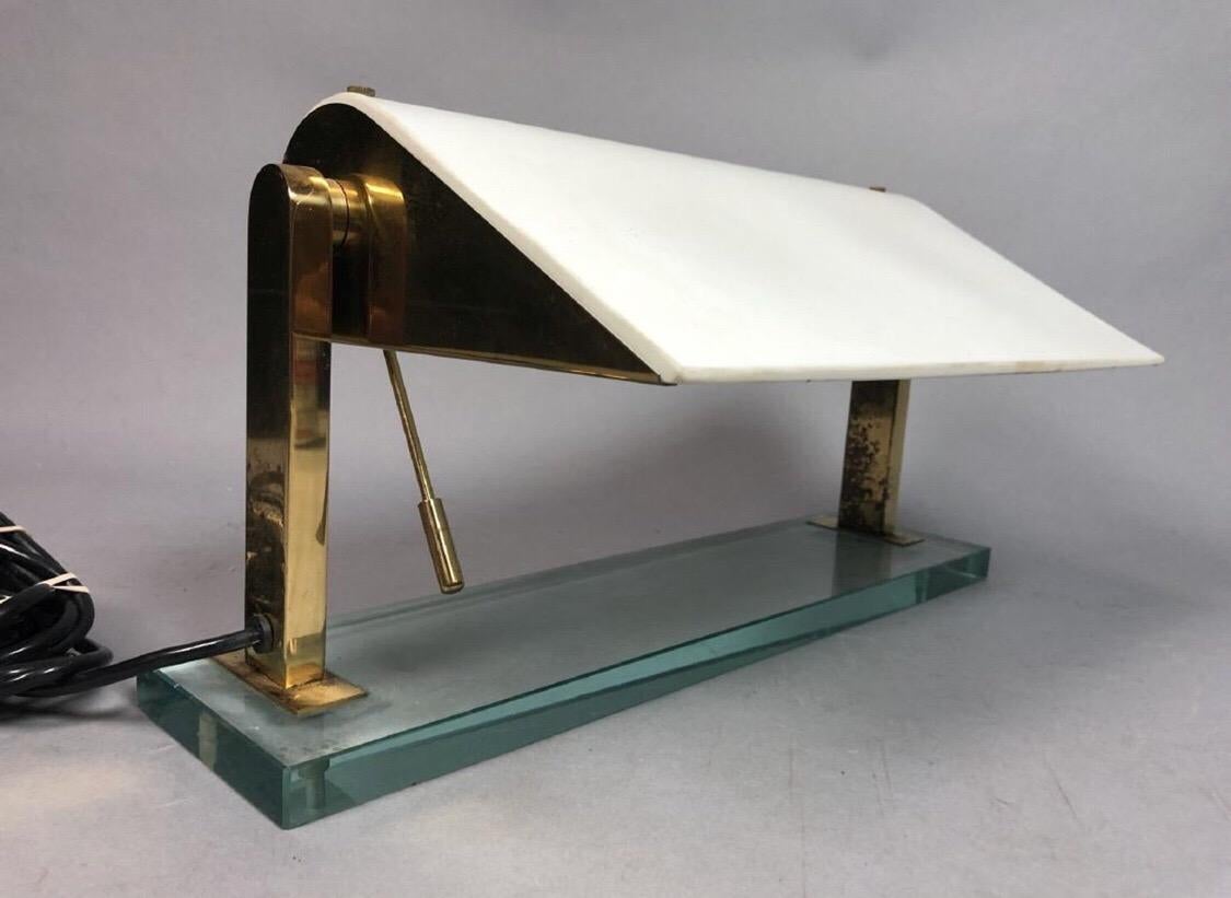 Gorgeous glass and brass table or desk lamp designed by Pietro Chiesa for Fontana Arte of Italy. In original condition with just the right amount of patina.