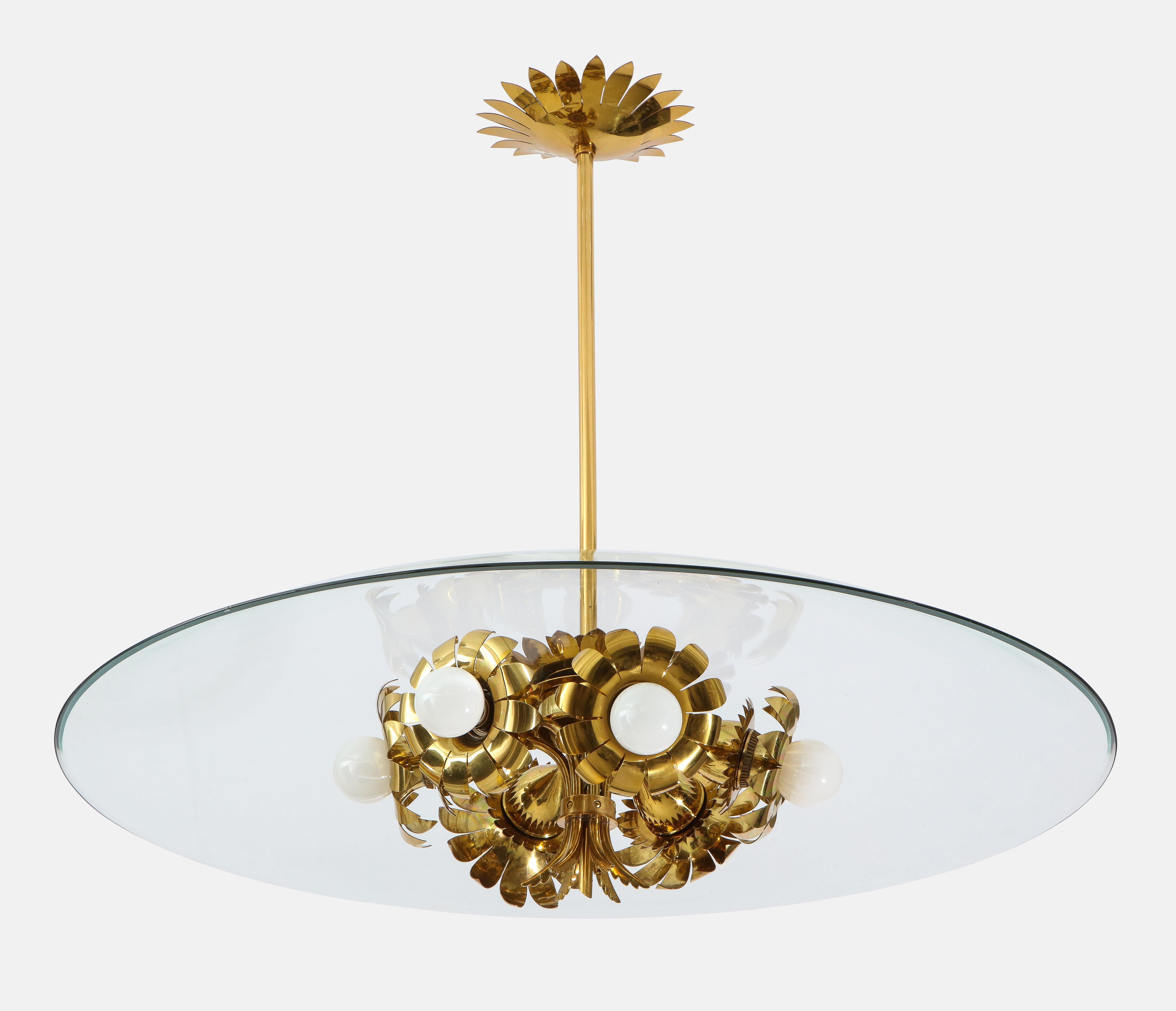 Max Ingrand for Fontana Arte model 1239 elegant chandelier or suspension ceiling light with large curved polished crystal glass disc atop frosted glass diffuser with central brass ornament, and suspended on brass mount, stem and original canopy.