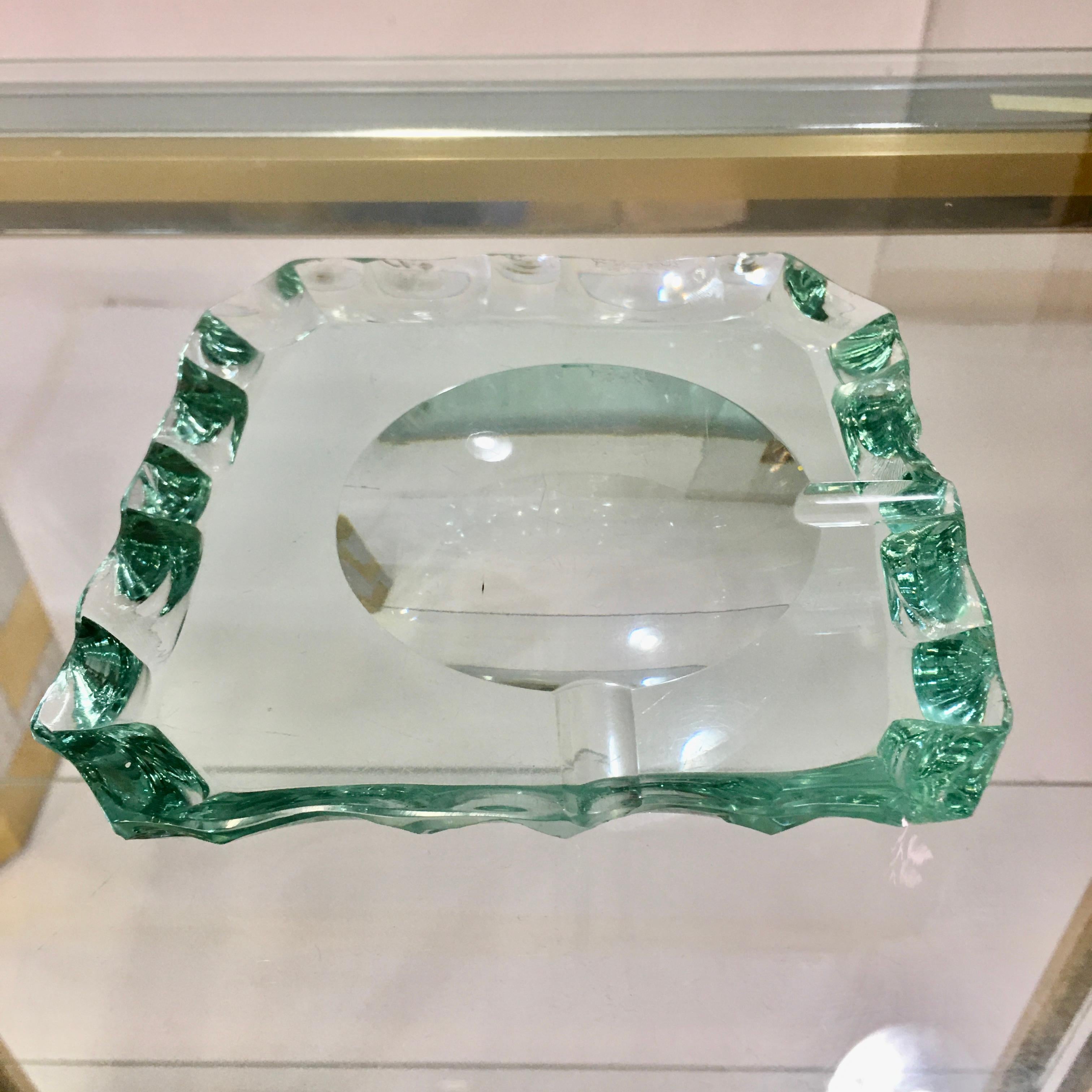 Scalloped edge green glass crystal ashtray by Pietro Chiesa for Fontana Arte.

  


