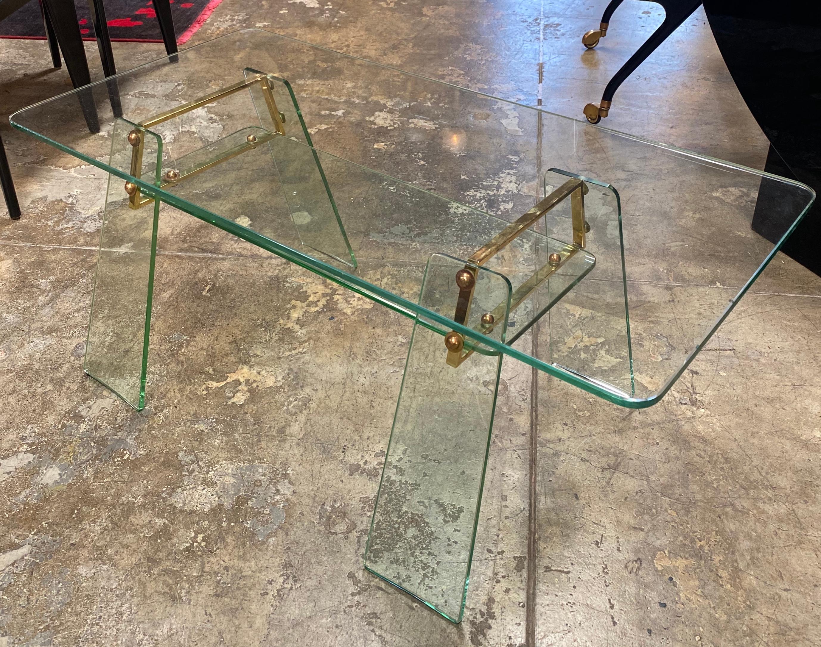 Extraordinary and extremely rare crystal glass and brass cocktail table. This masterpiece was designed by Pietro Chiesa for Fontana Arte, circa 1935.


A descendant of an eminent Ticino-based family of artists, he opened his own glass-making shop