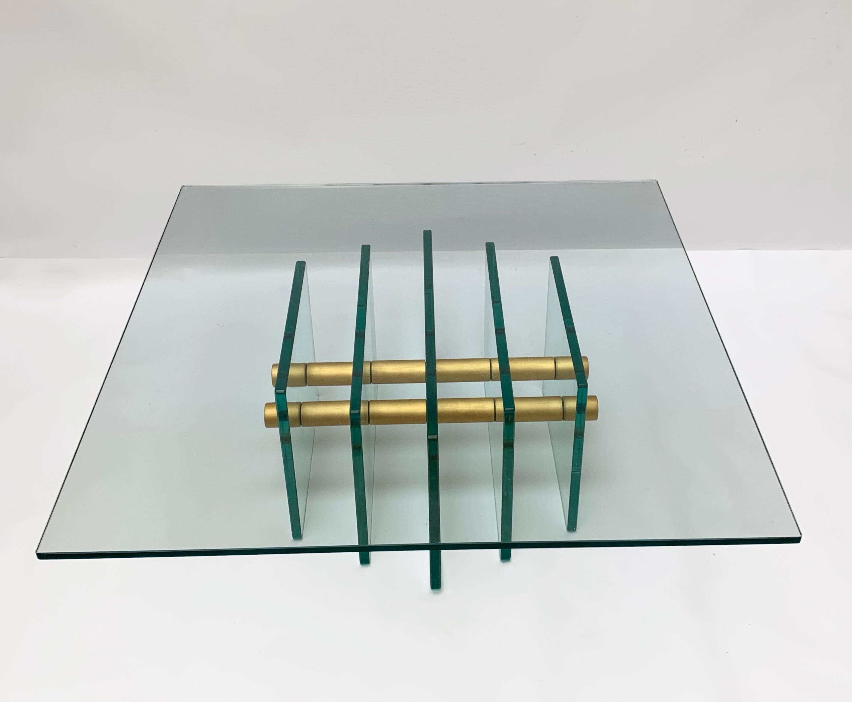 Extraordinary and extremely rare crystal glass and brass coffee table. This masterpiece was designed by Pietro Chiesa for Fontana Arte, circa 1935. 

This piece is wonderful because of its solid crystal glass structure, made of five vertical