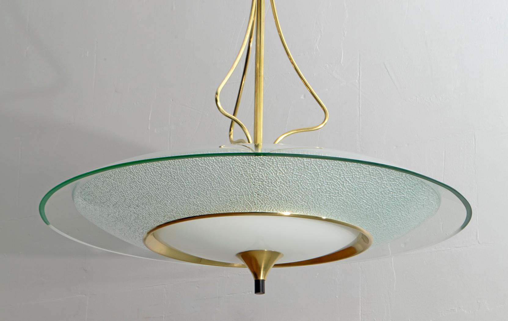 This Mid-Century glass and brass chandelier was designed by Pietro Chiesa for Fontana Arte in the 1940s.

The Italian Art Deco designer Pietro Chiesa was born in Milan in 1892 in a family of artists originally from Ticino, Switzerland. After his